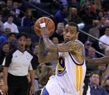 OAKLAND, CA - MARCH 25: Monta Ellis #8 of the Golden State Warriors drives to the basket against the Toronto Raptors at Oracle Arena on March 25, 2011 in Oakland, California. NOTE TO USER: User expressly acknowledges and agrees that, by downloading and or