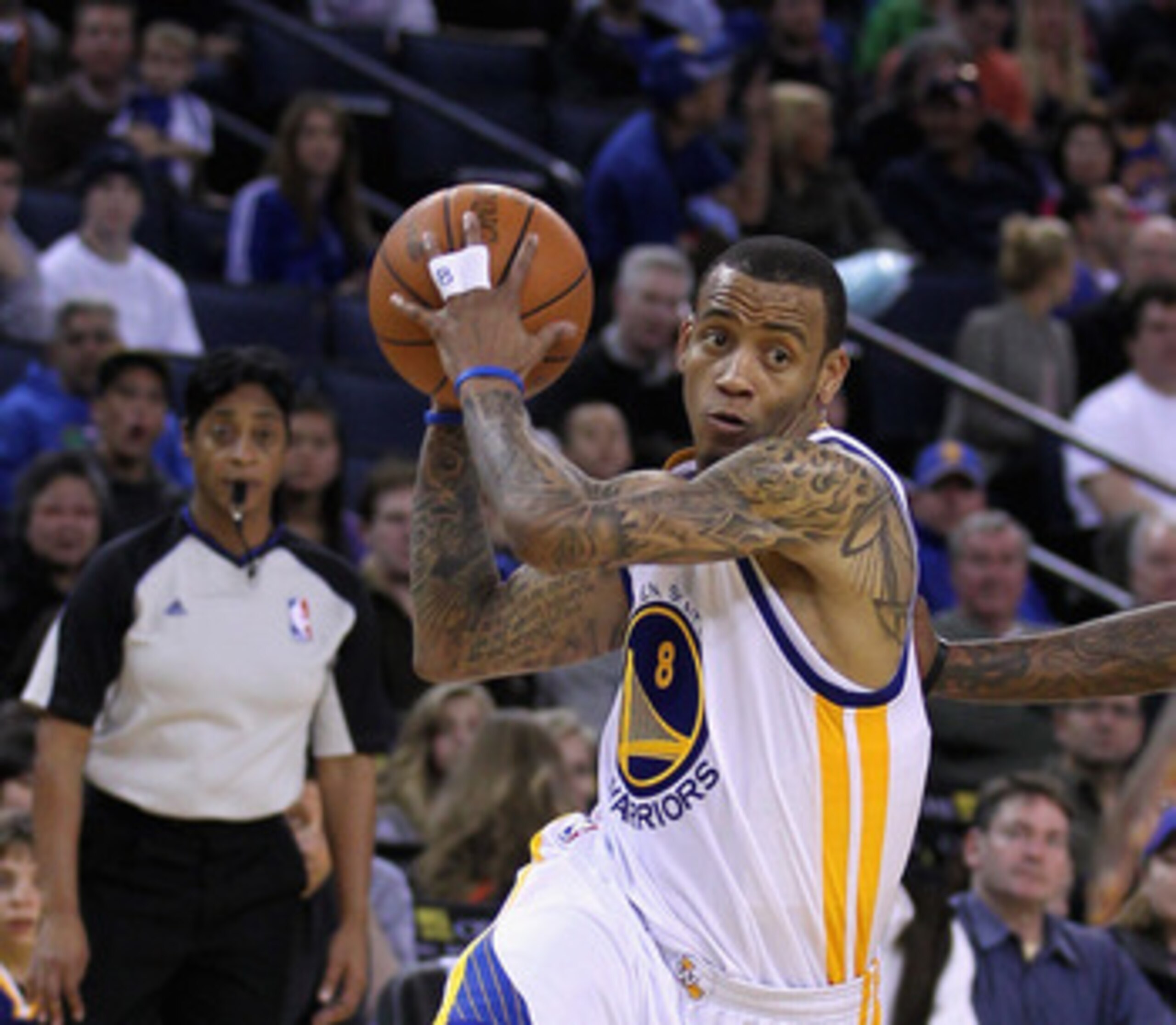 OAKLAND, CA - MARCH 25: Monta Ellis #8 of the Golden State Warriors drives to the basket against the Toronto Raptors at Oracle Arena on March 25, 2011 in Oakland, California. NOTE TO USER: User expressly acknowledges and agrees that, by downloading and or