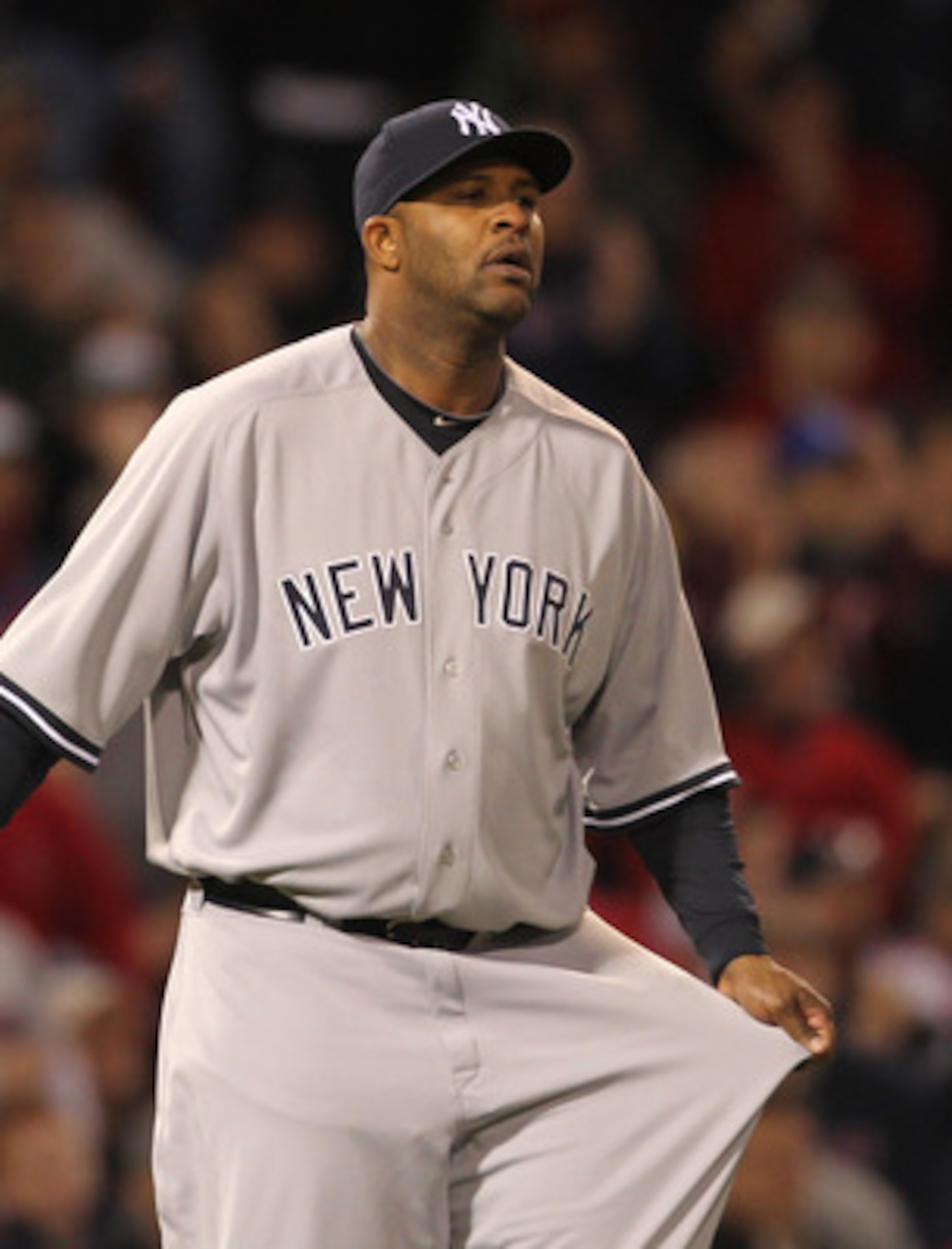 BOSTON, MA - APRIL 10:  CC Sabathia #52 of the New York Yankees reacts during a game against the Boston Red Sox at Fenway Park April 10, 2011 in Boston, Massachusetts. (Photo by Jim Rogash/Getty Images)
