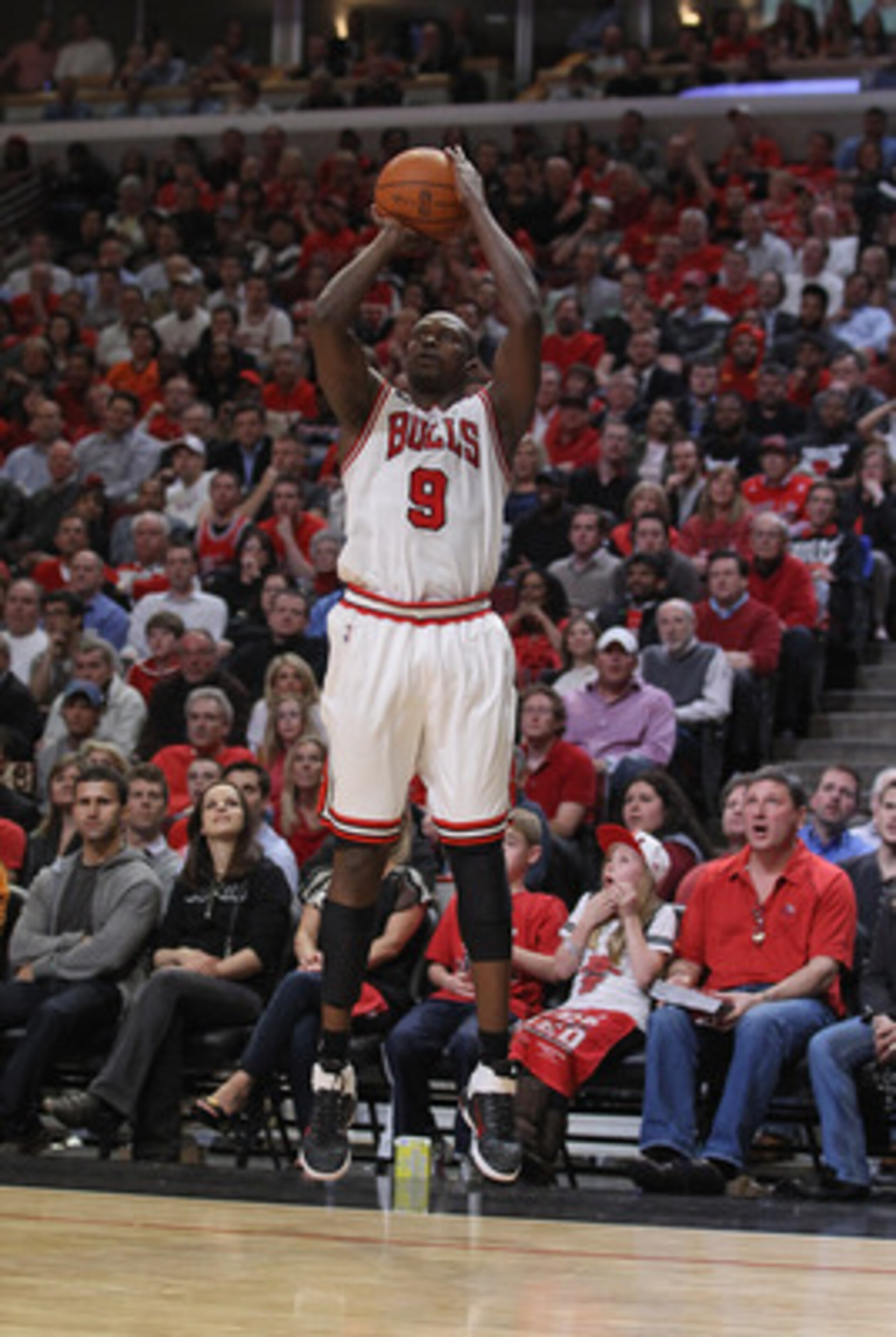 CHICAGO, IL - APRIL 26: Loul Deng #9 of the Chicago Bulls shoot a three-point shot against the Indiana Pacers in Game Five of the Eastern Conference Quarterfinals in the 2011 NBA Playoffs at the United Center on April 26, 2011 in Chicago, Illinois. The Bu
