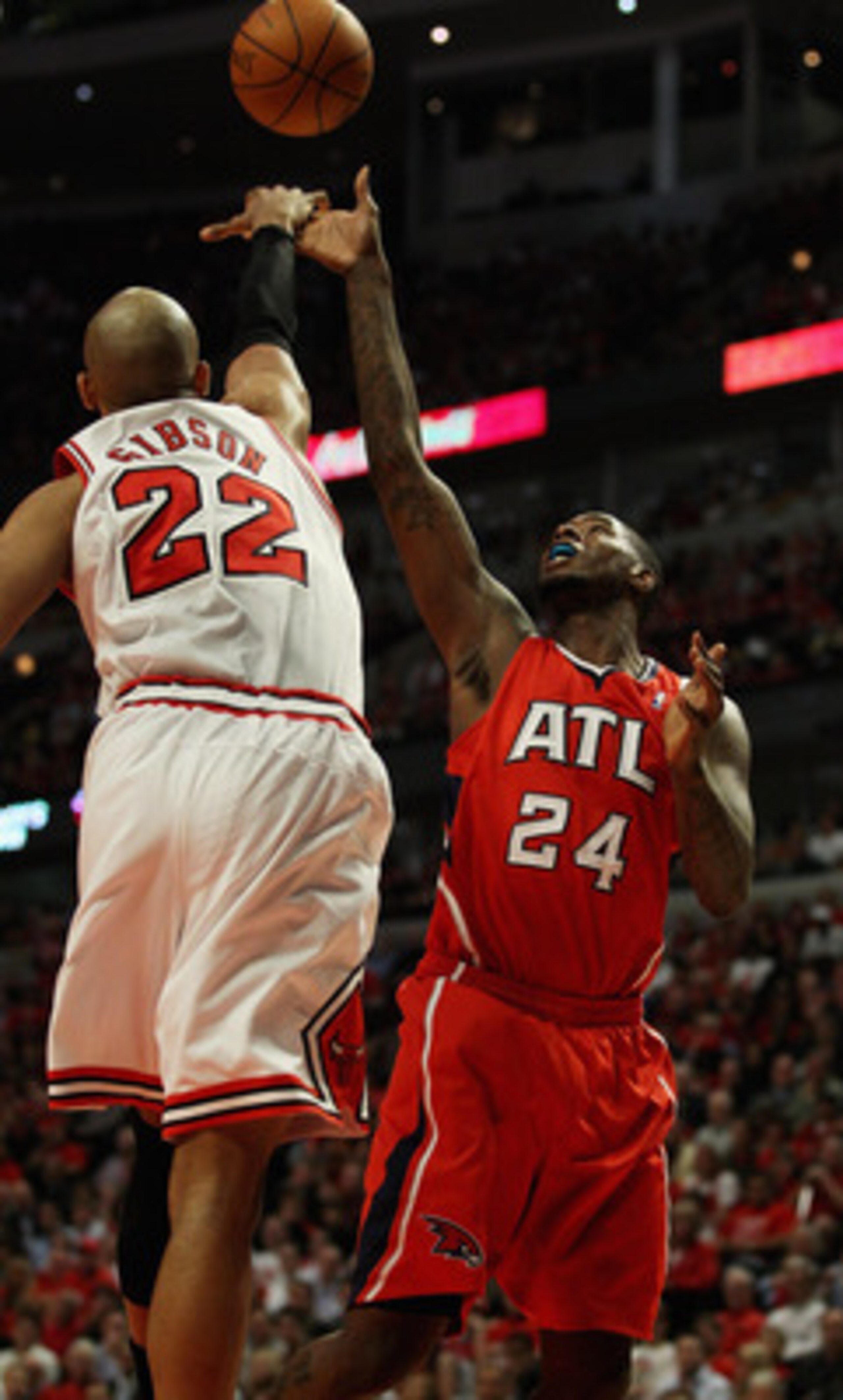 CHICAGO, IL - MAY 02: Taj Gibson #22 of the Chicago Bulls blocks a shot by Marvin Williams #24 of the Atlanta Hawks in Game One of the Eastern Conference Semifinals in the 2011 NBA Playoffs at the United Center on May 2, 2011 in Chicago, Illinois. NOTE TO