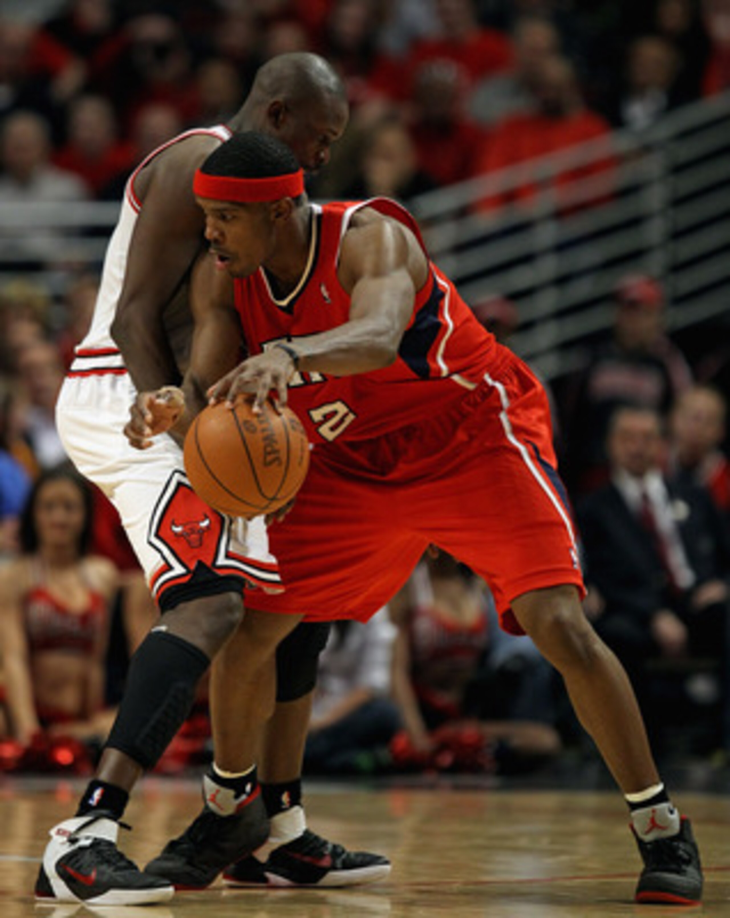 CHICAGO, IL - MAY 04: Joe Johnson #2 of the Atlanta Hawks tries to move against Loul Deng #9 of the Chicago Bulls in Game Two of the Eastern Conference Semifinals in the 2011 NBA Playoffs at the United Center on May 4, 2011 in Chicago, Illinois. The Bulls