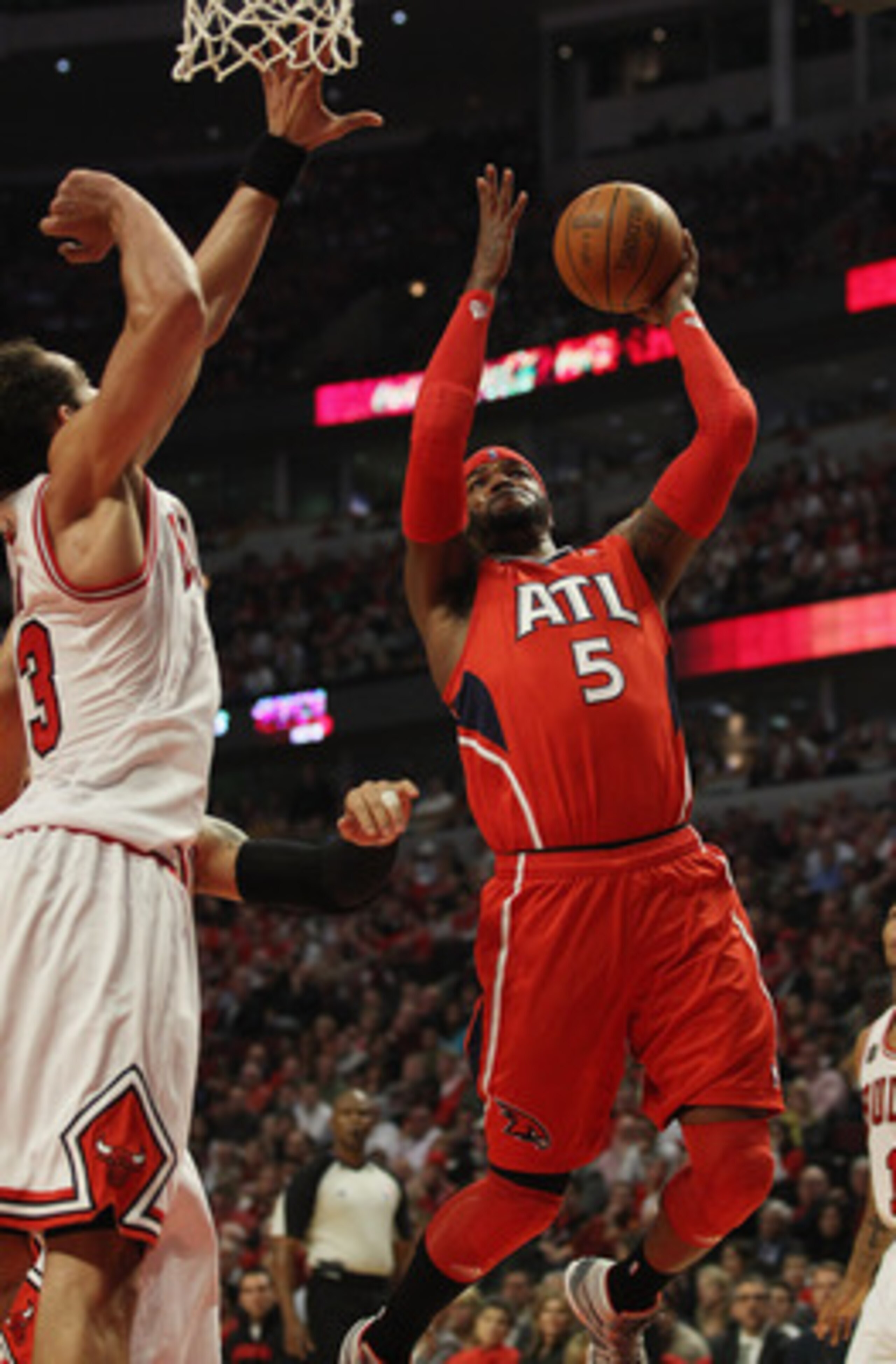 CHICAGO, IL - MAY 04: Josh Smith #5 of the Atlanta Hawks drives to the basket against Joakim Noah #13 of the Chicago Bulls in Game Two of the Eastern Conference Semifinals in the 2011 NBA Playoffs at the United Center on May 4, 2011 in Chicago, Illinois.
