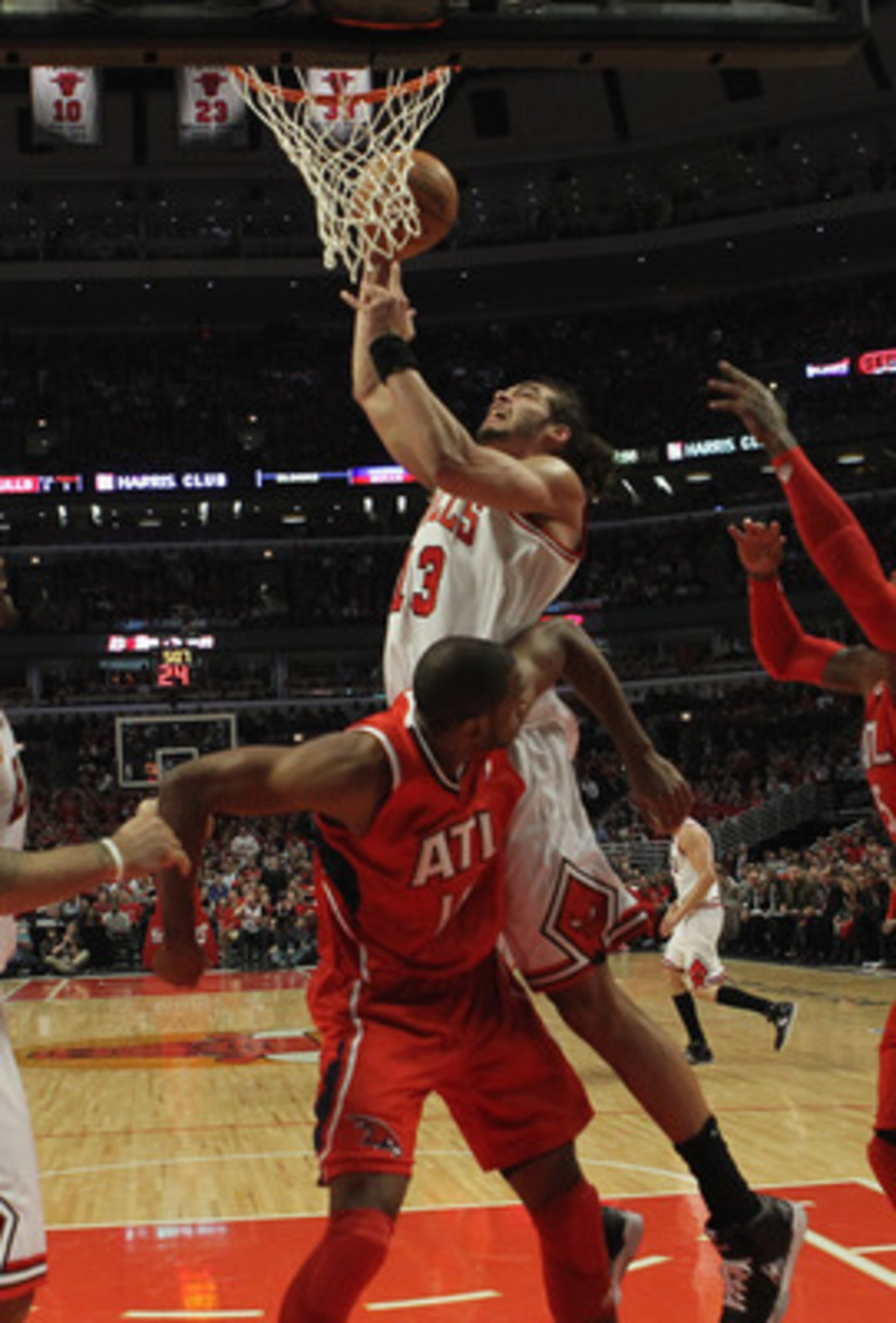 CHICAGO, IL - MAY 04: Joakim Noah #13 of the Chicago Bulls goes up for a shot over Al Horford #15 of the Atlanta Hawks in Game Two of the Eastern Conference Semifinals in the 2011 NBA Playoffs at the United Center on May 4, 2011 in Chicago, Illinois. The
