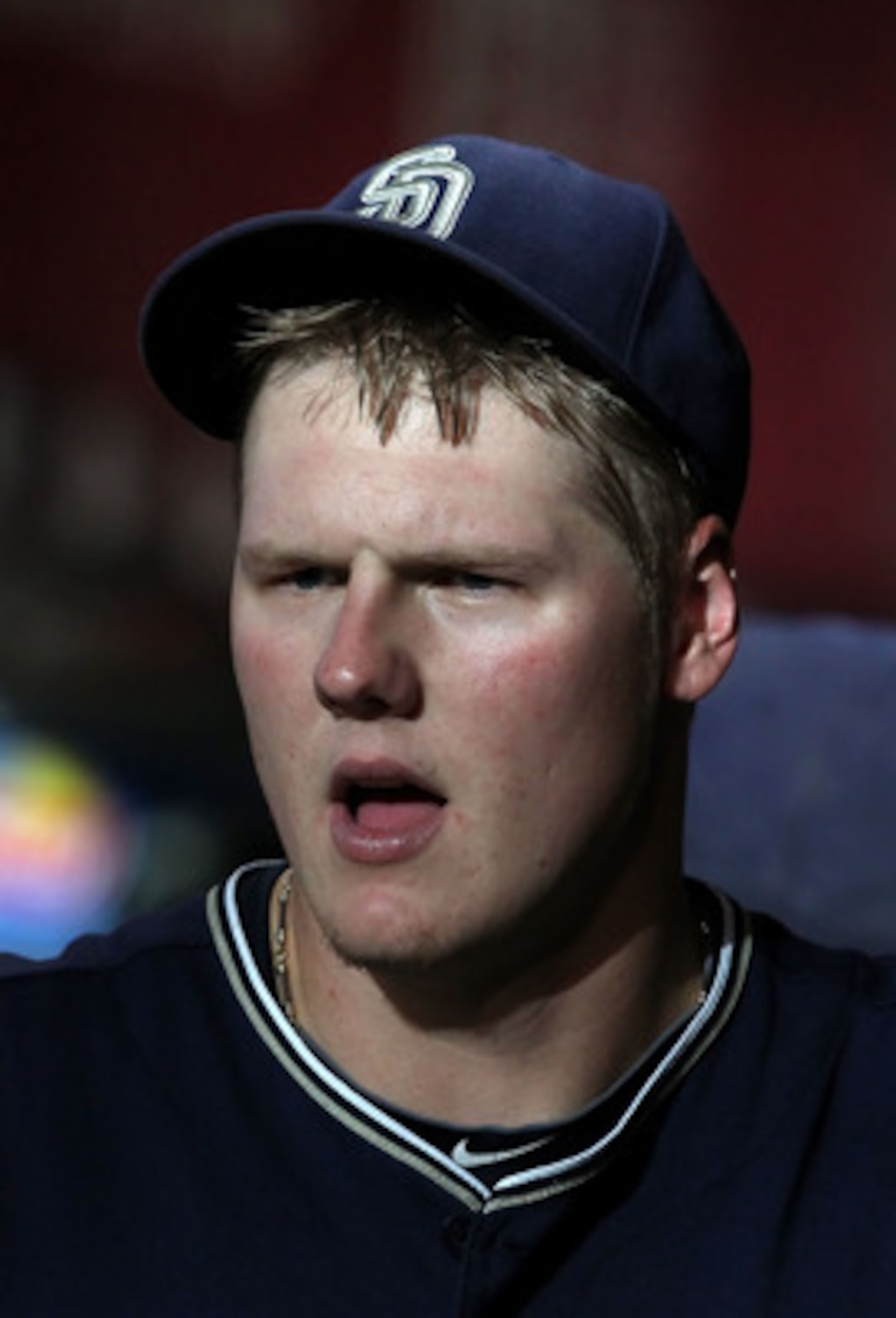 PHOENIX - SEPTEMBER 01:  Starting pitcher Mat Latos #38 of the San Diego Padres in the dugout during the Major League Baseball game against the Arizona Diamondbacks at Chase Field on September 1, 2010 in Phoenix, Arizona. The Diamondbacks defeated the Pad