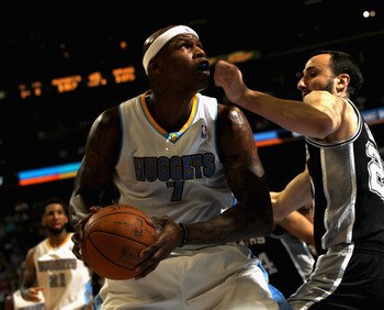 DENVER, CO - MARCH 23:  Al Harrington #7 of the Denver Nuggets looks to take a shot against Manu Ginobili #20 of the San Antonio Spurs at the Pepsi Center on March 23, 2011 in Denver, Colorado. Harrington had a game high 27 points as the Nuggets defeated