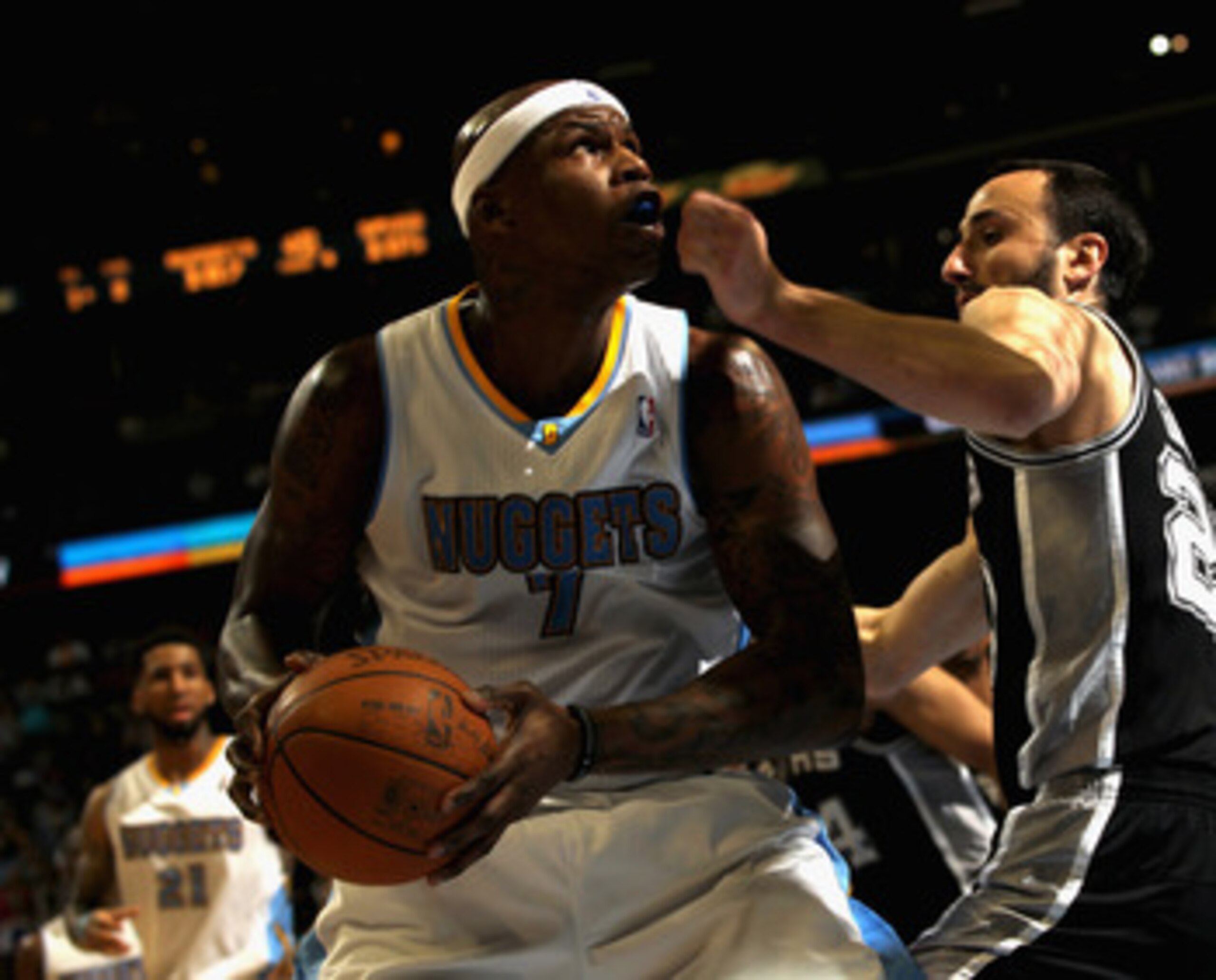 DENVER, CO - MARCH 23:  Al Harrington #7 of the Denver Nuggets looks to take a shot against Manu Ginobili #20 of the San Antonio Spurs at the Pepsi Center on March 23, 2011 in Denver, Colorado. Harrington had a game high 27 points as the Nuggets defeated