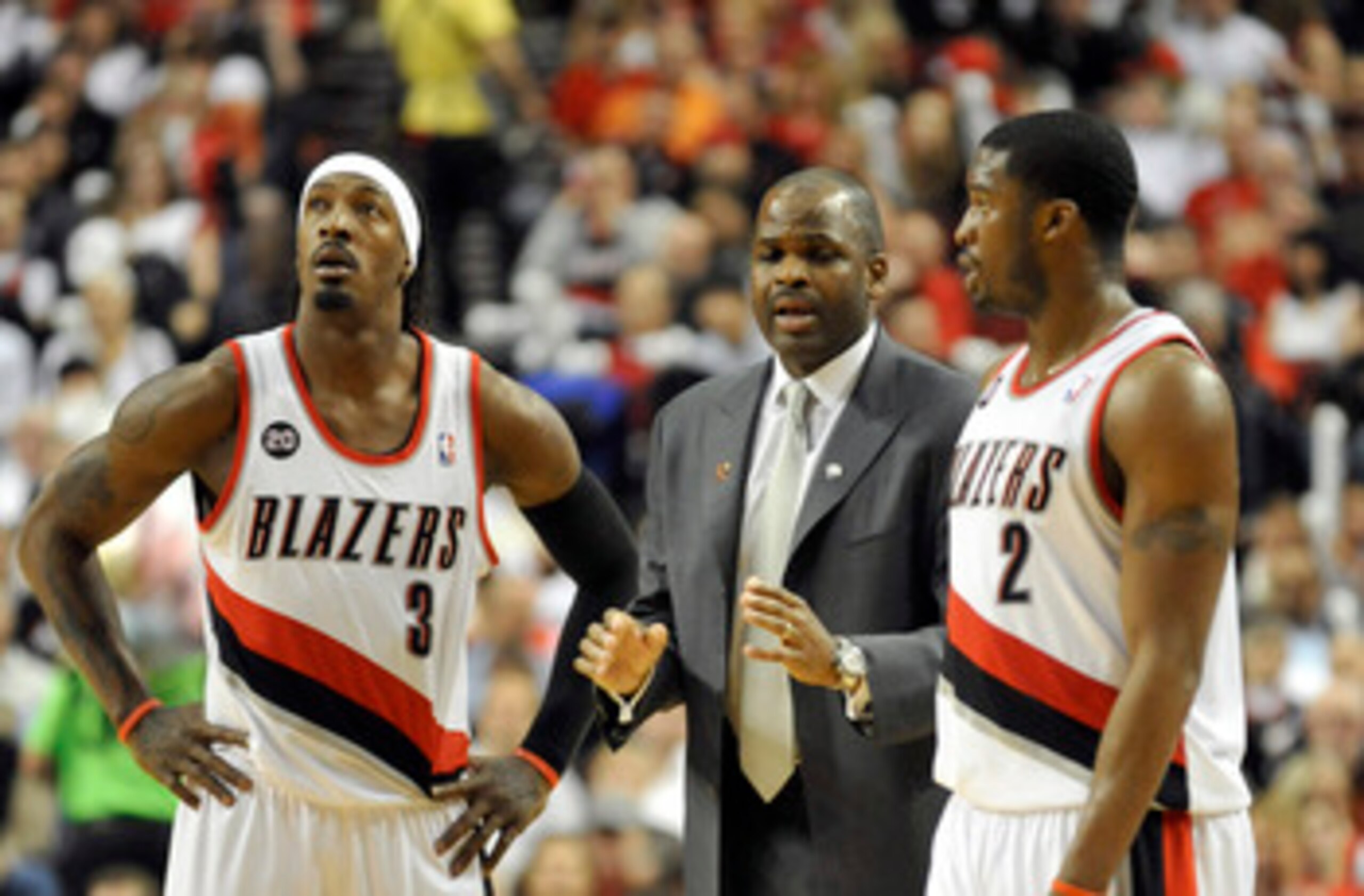 PORTLAND, OR - APRIL 28: (L to R) Gerald Wallace #3, head coach Nate McMillan and Wes Matthews #2 of the Portland Trail Blazers gather during a time out in the fourth quarter of Game Six of the Western Conference Quartefinals in the 2011 NBA Playsoffs on