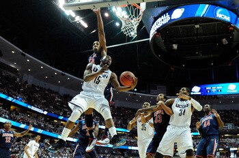 ANAHEIM, CA - MARCH 26:  Kemba Walker #15 of the Connecticut Huskies goes to the basket against Derrick Williams #23 of the Arizona Wildcats during the west regional final of the 2011 NCAA men's basketball tournament at the Honda Center on March 26, 2011 