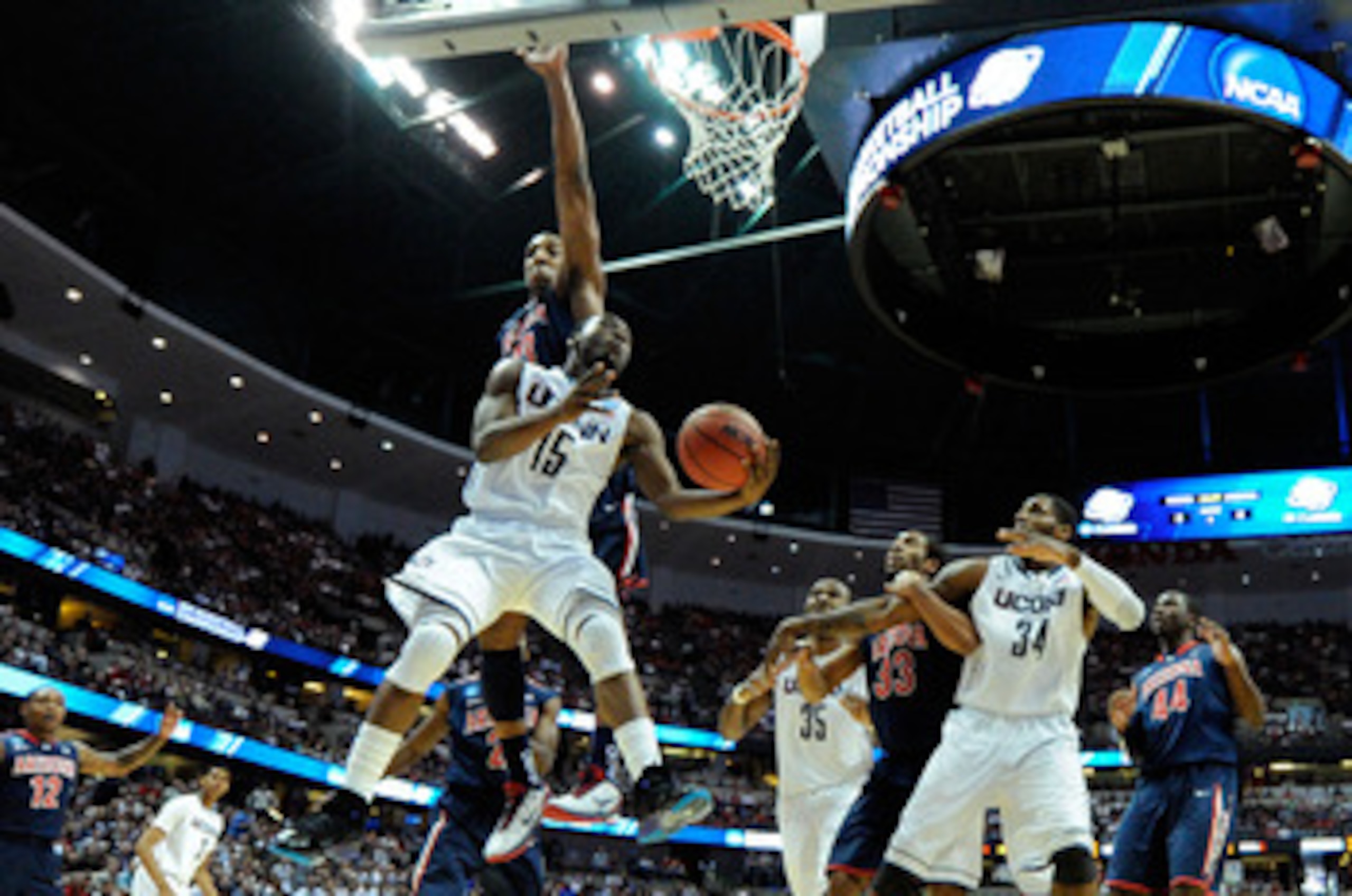 ANAHEIM, CA - MARCH 26:  Kemba Walker #15 of the Connecticut Huskies goes to the basket against Derrick Williams #23 of the Arizona Wildcats during the west regional final of the 2011 NCAA men's basketball tournament at the Honda Center on March 26, 2011 