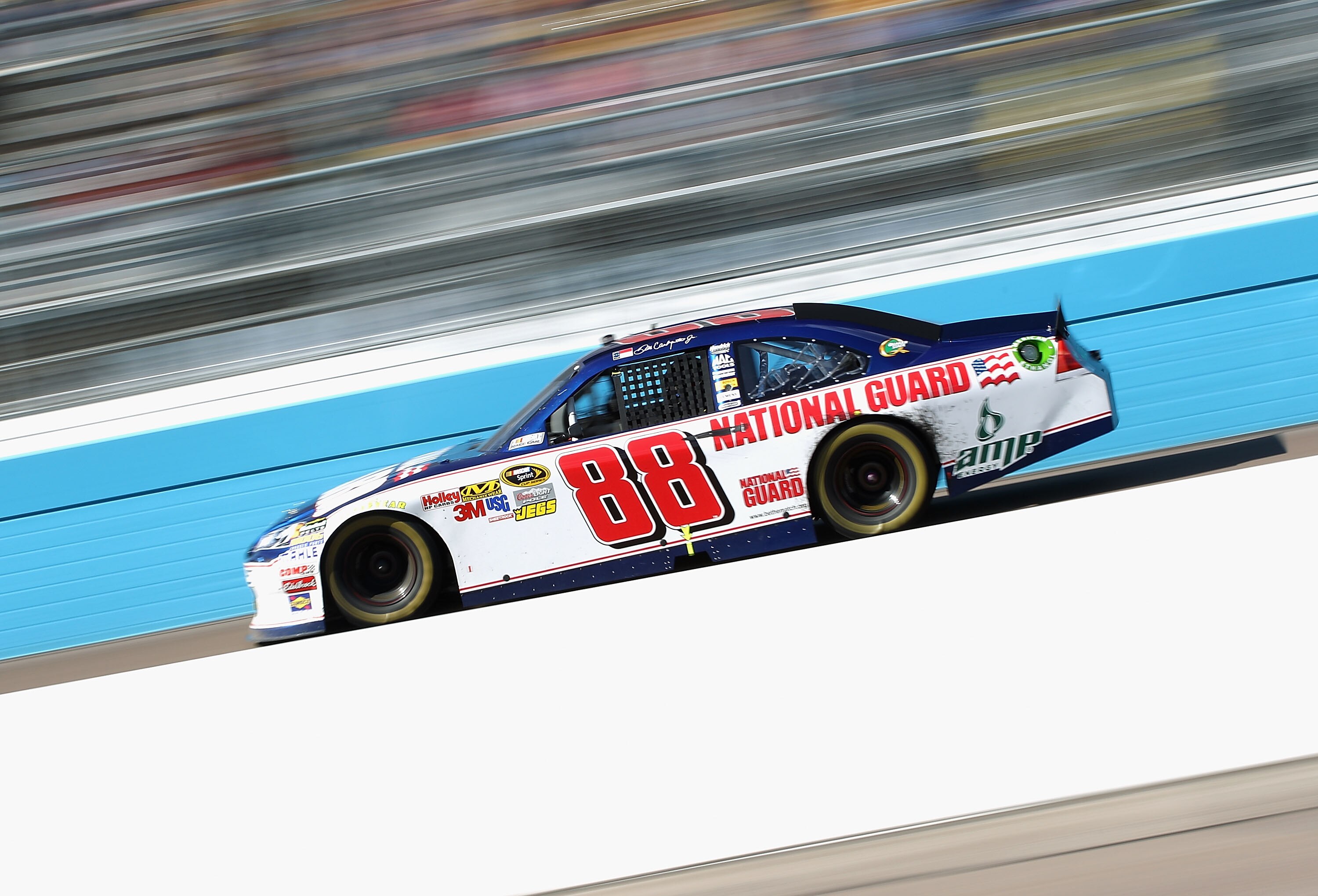 AVONDALE, AZ - FEBRUARY 27:  Dale Earnhardt Jr., driver of the #88 National Guard/AMP Energy Chevrolet, races during the NASCAR Sprint Cup Series Subway Fresh Fit 500 at Phoenix International Raceway on February 27, 2011 in Avondale, Arizona.  (Photo by C
