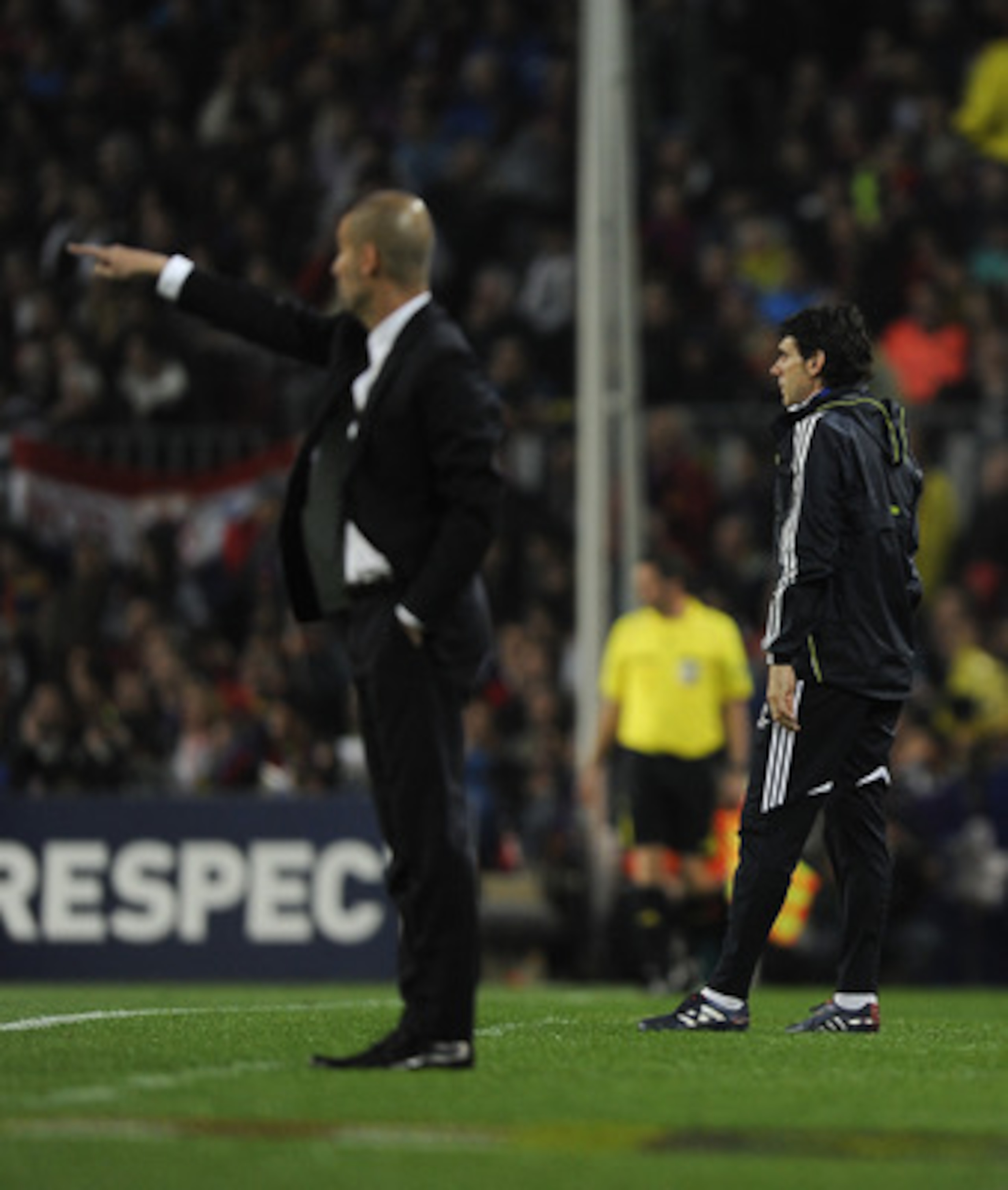 BARCELONA, SPAIN - MAY 03: Coach assistant of Real Madrid Aior Karanka (R) and Head coach of FC Barcelona Josep Guardiola look on during the UEFA Champions League Semi Final second leg match between Barcelona and Real Madrid at the Camp Nou on May 3, 2011