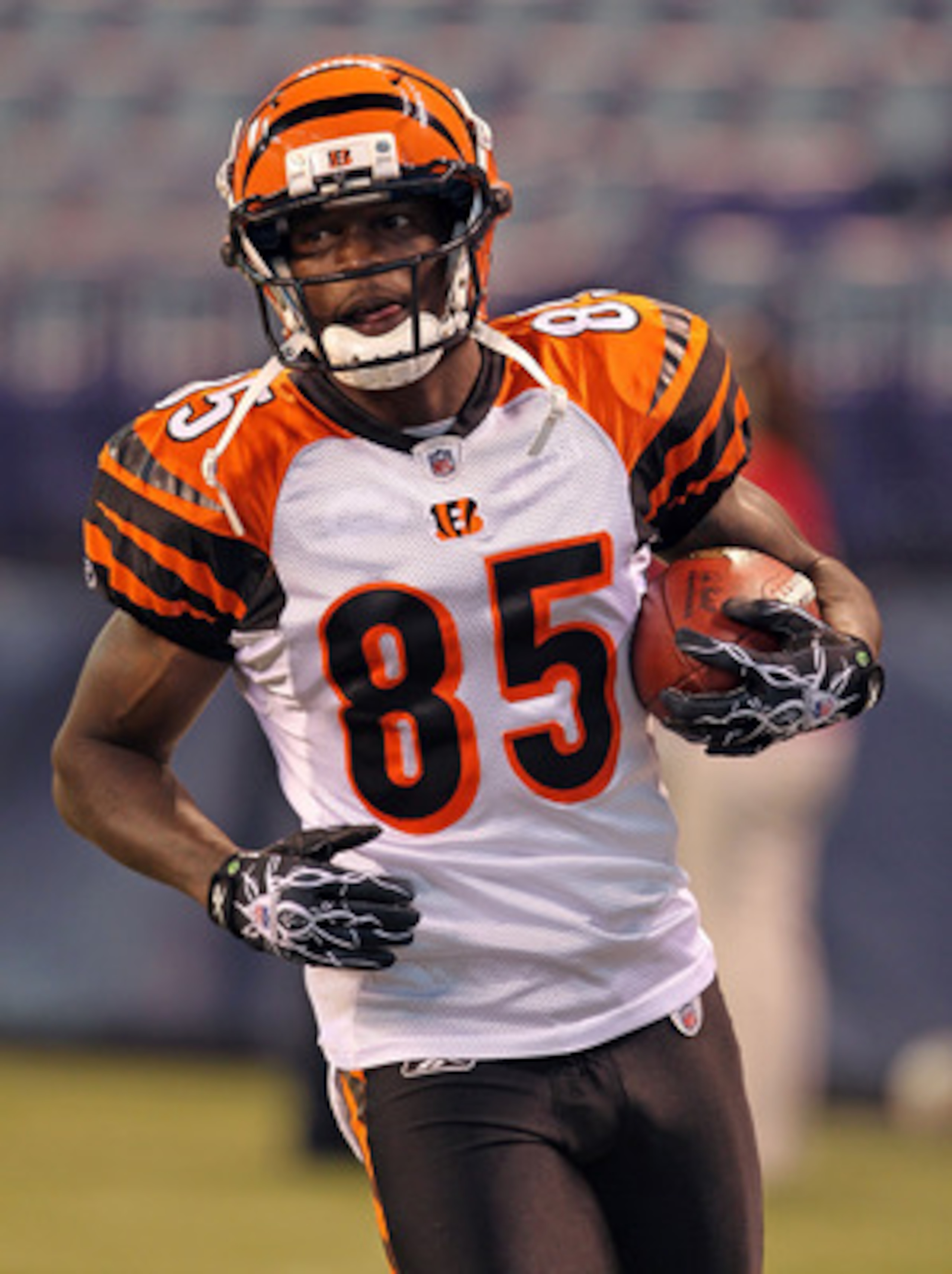 INDIANAPOLIS - SEPTEMBER 02:  Chad Ochocinco #85 of the Cincinnati Bengals runs with the ball before the NFL preseason game against the Indianapolis Colts at Lucas Oil Stadium on September 2, 2010 in Indianapolis, Indiana.  (Photo by Andy Lyons/Getty Imag