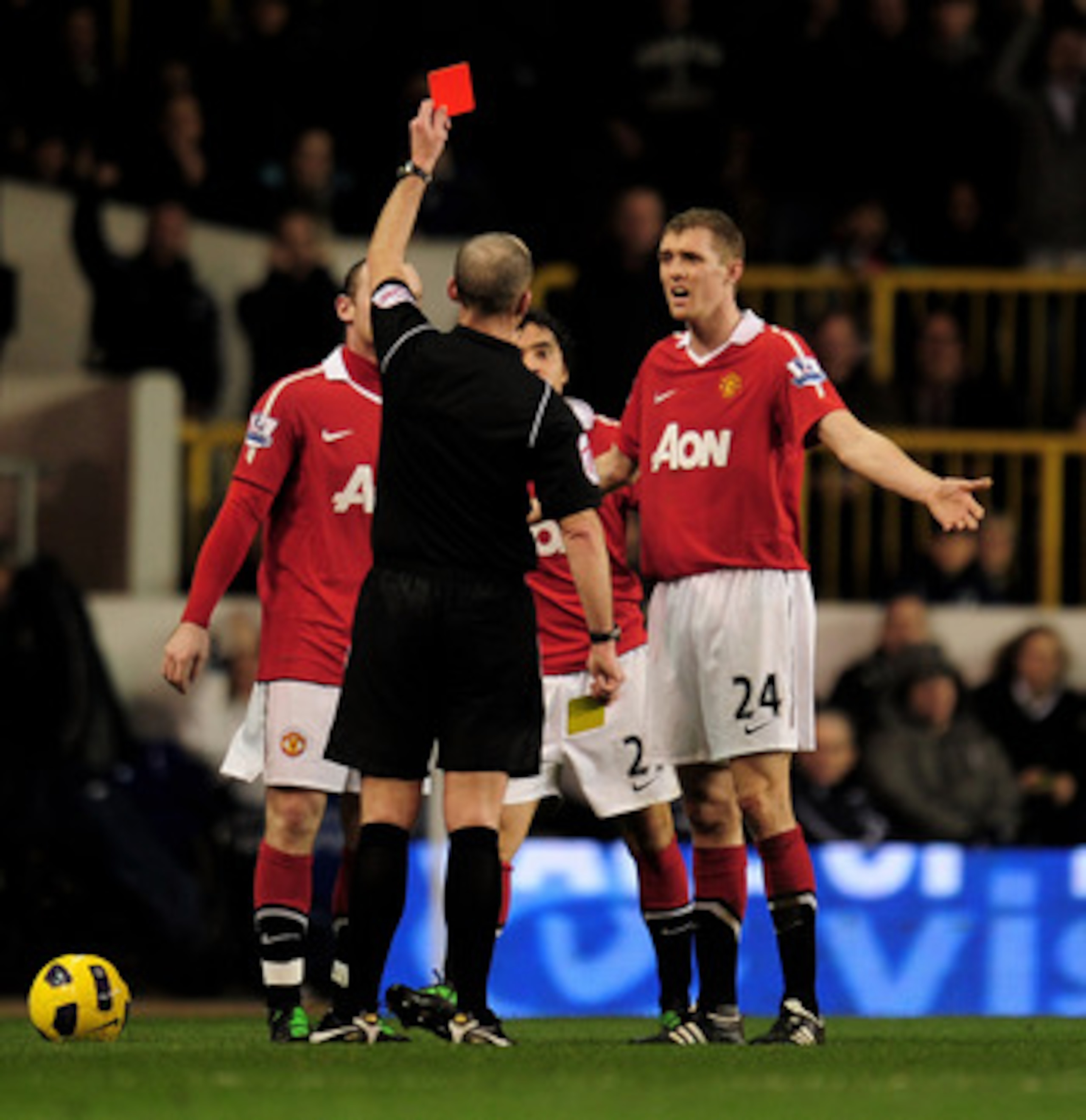 LONDON, ENGLAND - JANUARY 16: Rafael Da Silva (centre-obscured) of Manchester United reacts as he is shown the red card following his second bookable offence by Referee Mike Dean during the Barclays Premier League match between Tottenham Hotspur and Manc LONDON, ENGLAND - JANUARY 16: Rafael Da Silva (centre-obscured) of Manchester United reacts as he is shown the red card following his second bookable offence by Referee Mike Dean during the Barclays Premier League match between Tottenham Hotspur and Manc