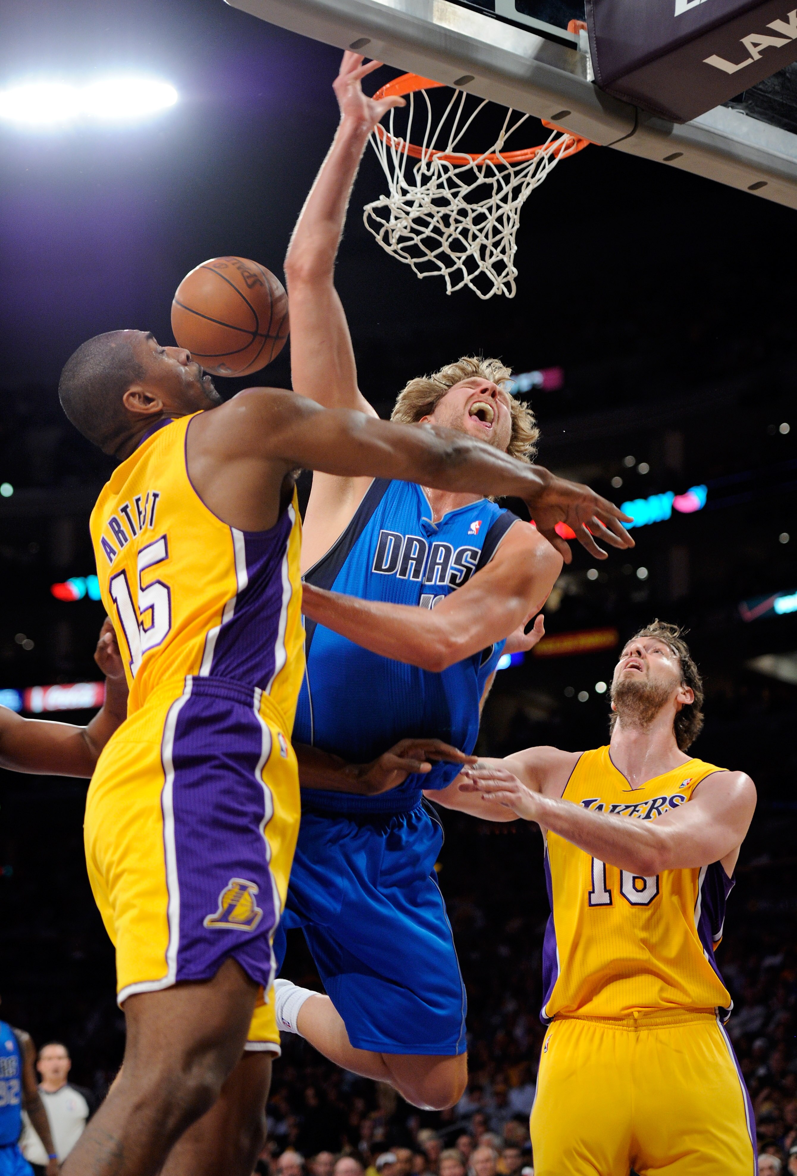 LOS ANGELES, CA - MAY 04:  Dirk Nowitzki #41 of the Dallas Mavericks goes up for a shot between Ron Artest #15 and Pau Gasol #16 of the Los Angeles Lakers in the first quarter in Game Two of the Western Conference Semifinals in the 2011 NBA Playoffs at St