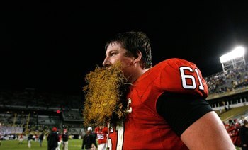 ATLANTA - NOVEMBER 28:  Ben Jones #61 of the Georgia Bulldogs celebrates their 30-24 win over the Georgia Tech Yellow Jackets with a some grass from the end zone at Bobby Dodd Stadium on November 28, 2009 in Atlanta, Georgia.  (Photo by Kevin C. Cox/Getty
