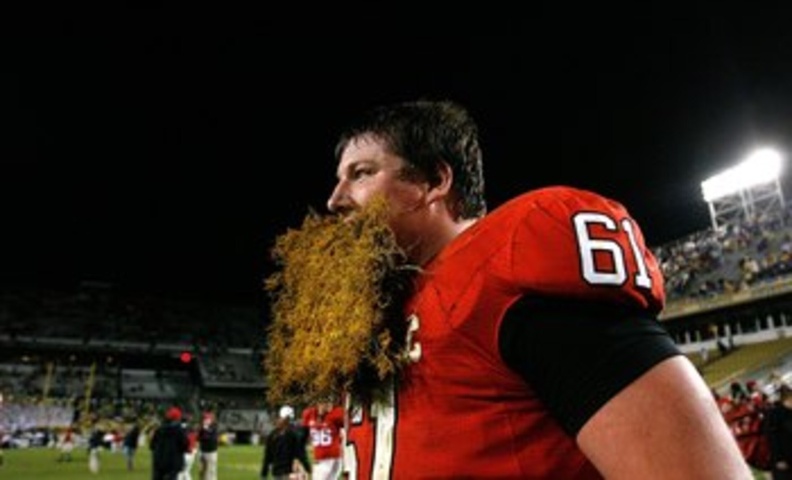 ATLANTA - NOVEMBER 28:  Ben Jones #61 of the Georgia Bulldogs celebrates their 30-24 win over the Georgia Tech Yellow Jackets with a some grass from the end zone at Bobby Dodd Stadium on November 28, 2009 in Atlanta, Georgia.  (Photo by Kevin C. Cox/Getty