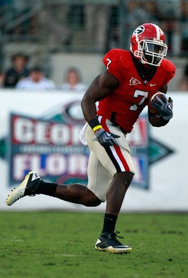 JACKSONVILLE, FL - OCTOBER 30:  Orson Charles #7 of the Georgia Bulldogs runs for yardage during the game against the Florida Gators at EverBank Field on October 30, 2010 in Jacksonville, Florida.  (Photo by Sam Greenwood/Getty Images)