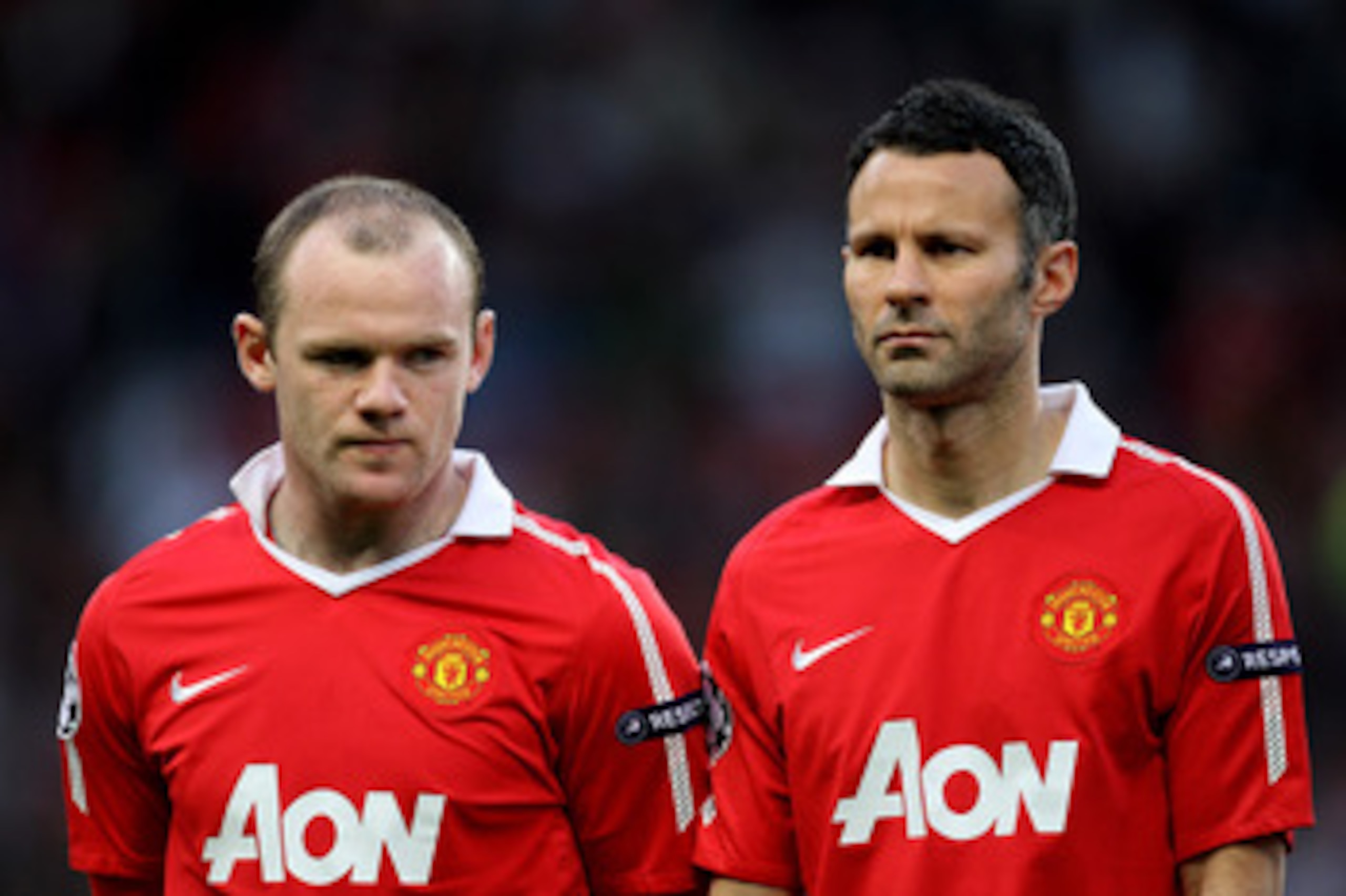 MANCHESTER, ENGLAND - APRIL 12: Wayne Rooney (L) and Ryan Giggs of Manchester United line up prior to the UEFA Champions League Quarter Final second leg match between Manchester United and Chelsea at Old Trafford on April 12, 2011 in Manchester, England. MANCHESTER, ENGLAND - APRIL 12: Wayne Rooney (L) and Ryan Giggs of Manchester United line up prior to the UEFA Champions League Quarter Final second leg match between Manchester United and Chelsea at Old Trafford on April 12, 2011 in Manchester, England.