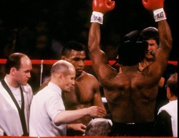 22 Nov 1986: Mike Tyson raises his arms in victory after a fight against Trevor Berbick in Las Vegas, Nevada. Tyson won the bout with a TKO in the second round. 22 Nov 1986: Mike Tyson raises his arms in victory after a fight against Trevor Berbick in Las Vegas, Nevada. Tyson won the bout with a TKO in the second round.