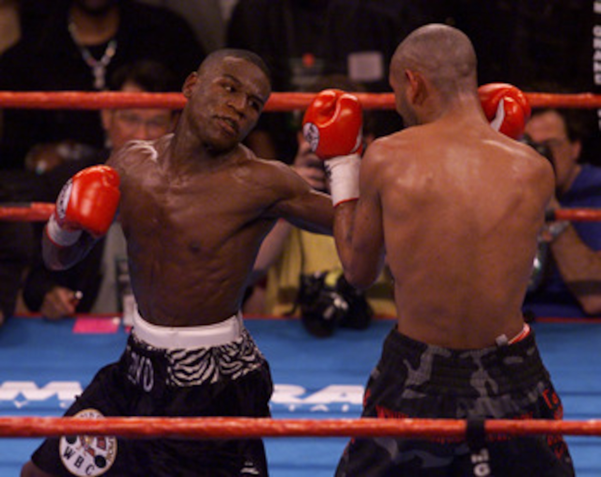 20 Jan 2001:  Floyd Mayweather, left, prepares to throw a right hand at Diego Corrales during their WBC Super Featherweight Championship bout at the MGM Grand Garden Arena in Las Vegas, Nevada.  DIGITAL IMAGE Mandatory Credit: Jeff Gross/ALLSPORT