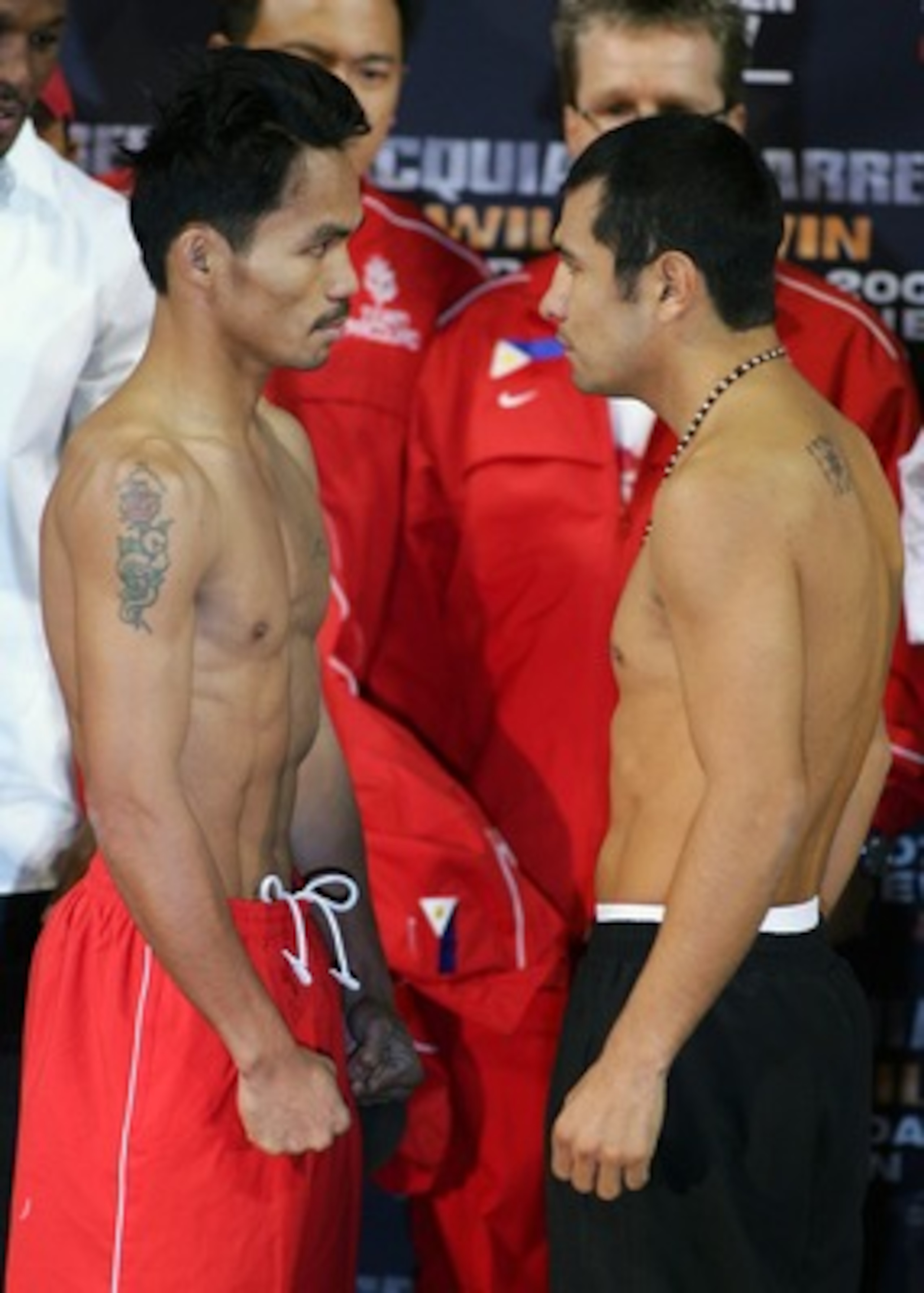 LAS VEGAS - OCTOBER 05:  Boxers Manny Pacquiao (L) of Philippines and Marco Antonio Barrera of Mexico face off during their official weigh-in at the Mandalay Bay Events Center October 5, 2007 in Las Vegas, Nevada. Barrera and Pacquiao will meet in a 12-ro