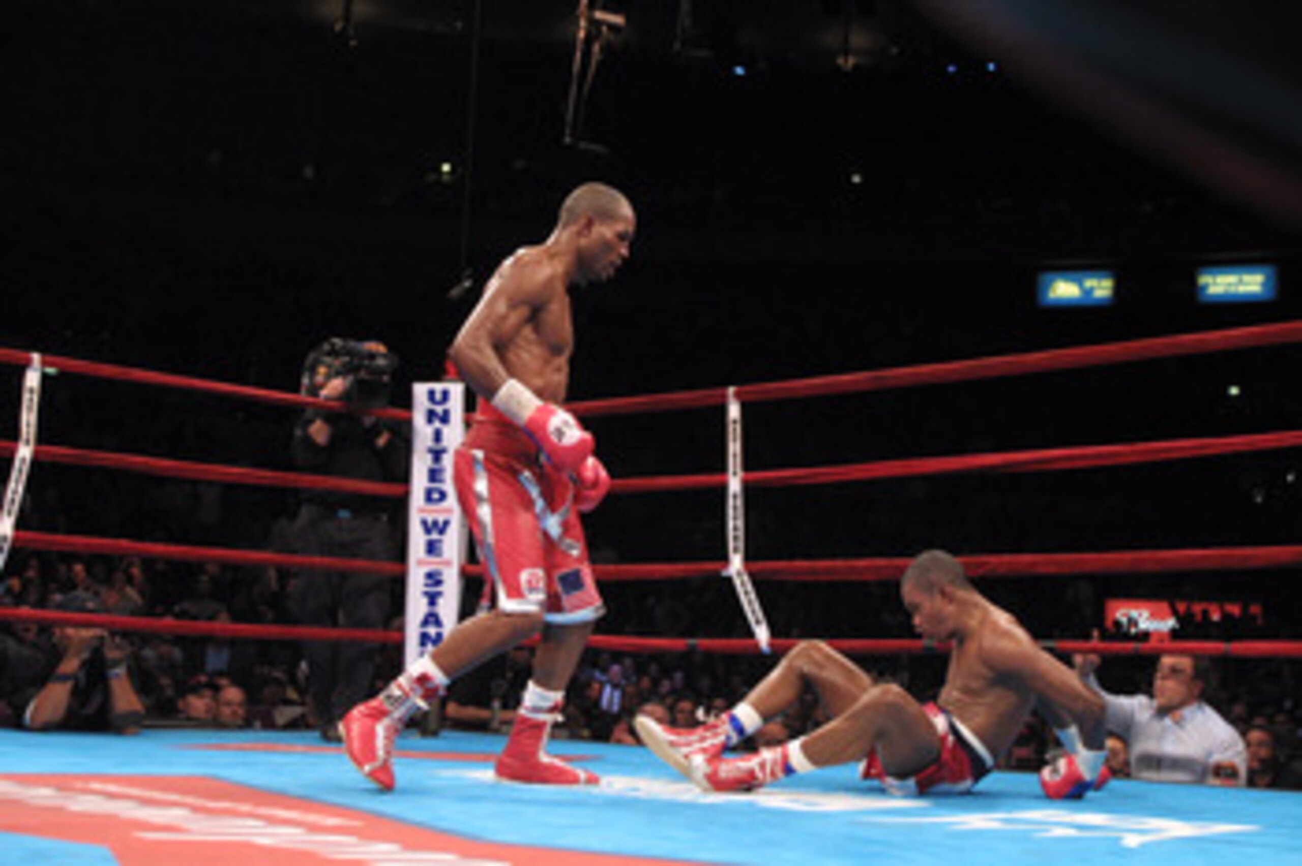 29 Sep 2001: Felix Trinidad sits on the canvas after being knocked  down by Bernard Hopkins at the end of their middleweight championship unification fight at Madison Square Garden in New York, New York. Hopkins won with a twelth round technical knockout.