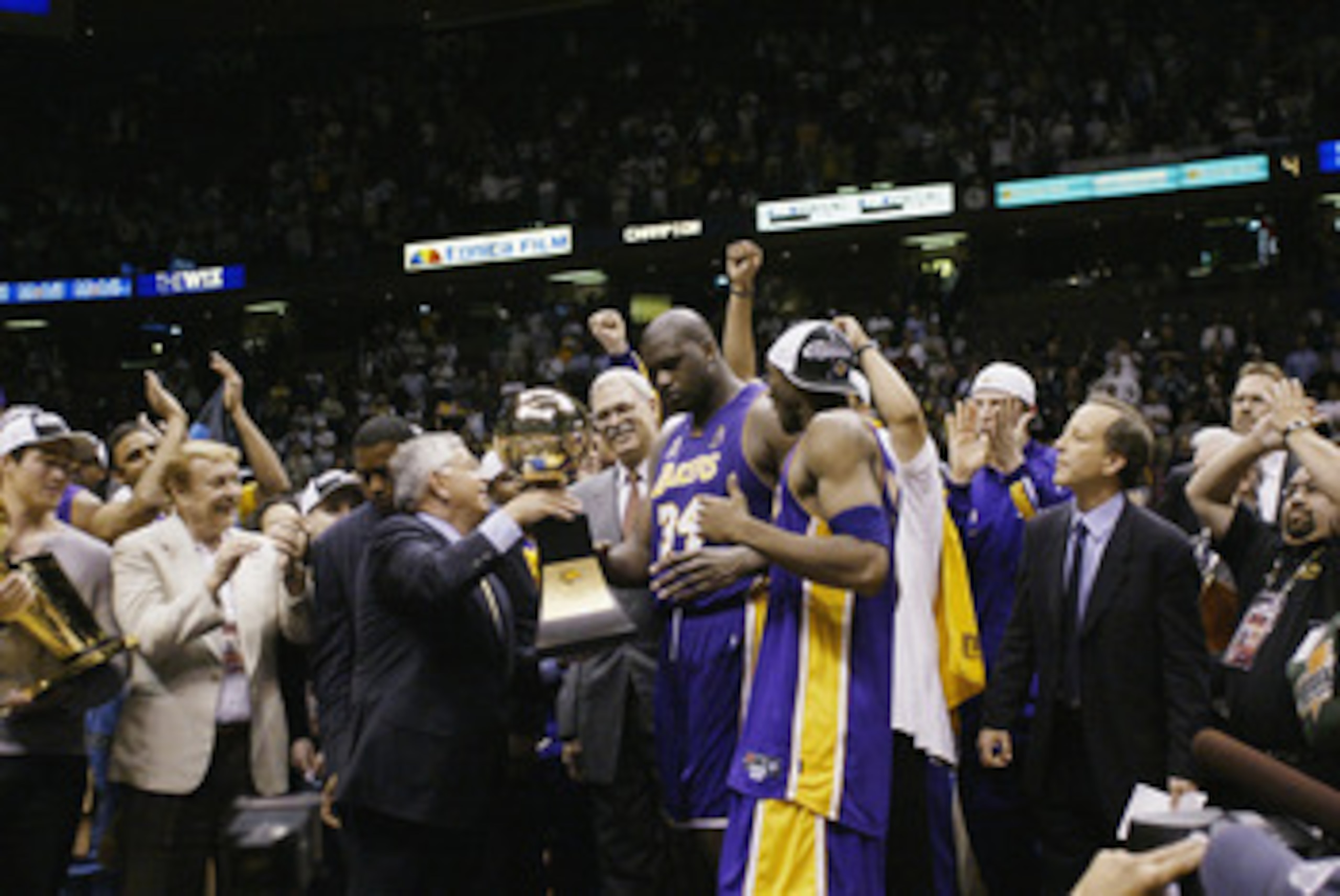 EAST RUTHERFORD, NJ - JUNE 12:  Shaquille O'Neal #34 of the Los Angeles Lakers is presented with the MVP trophy after defeating the New Jersey Nets in Game four of the 2002 NBA Finals on June 12, 2002 at Continental Airlines Arena in East Rutherford, New