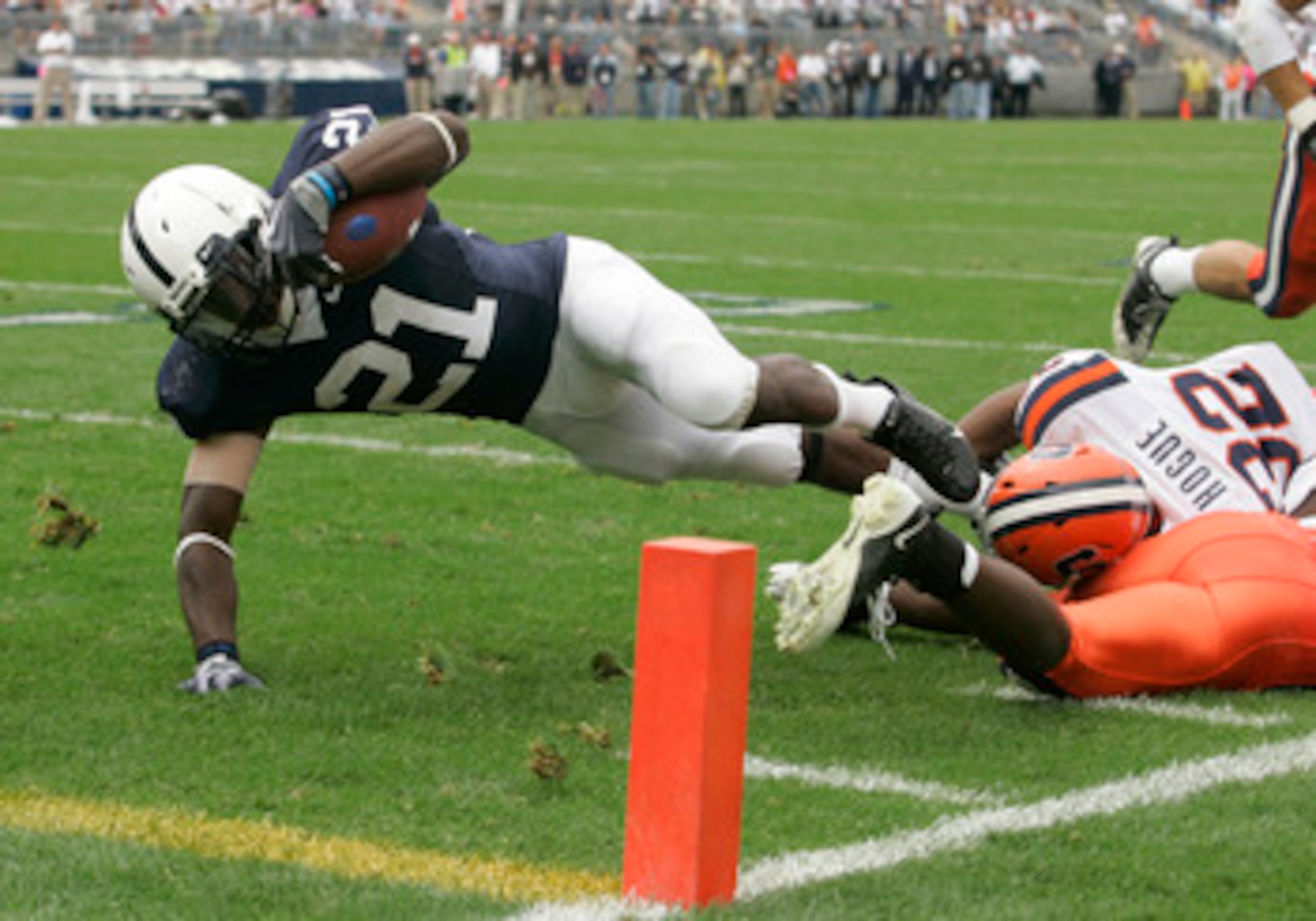 STATE COLLEGE, PA - SEPTEMBER 12: Tailback Stefon Green #21 of the Penn State Nittany Lions is tackled short of the goal line by linebacker Doug Hogue #32 of the Syracuse Orangemen during the second half at Beaver Stadium  September 12, 2009 in State Coll