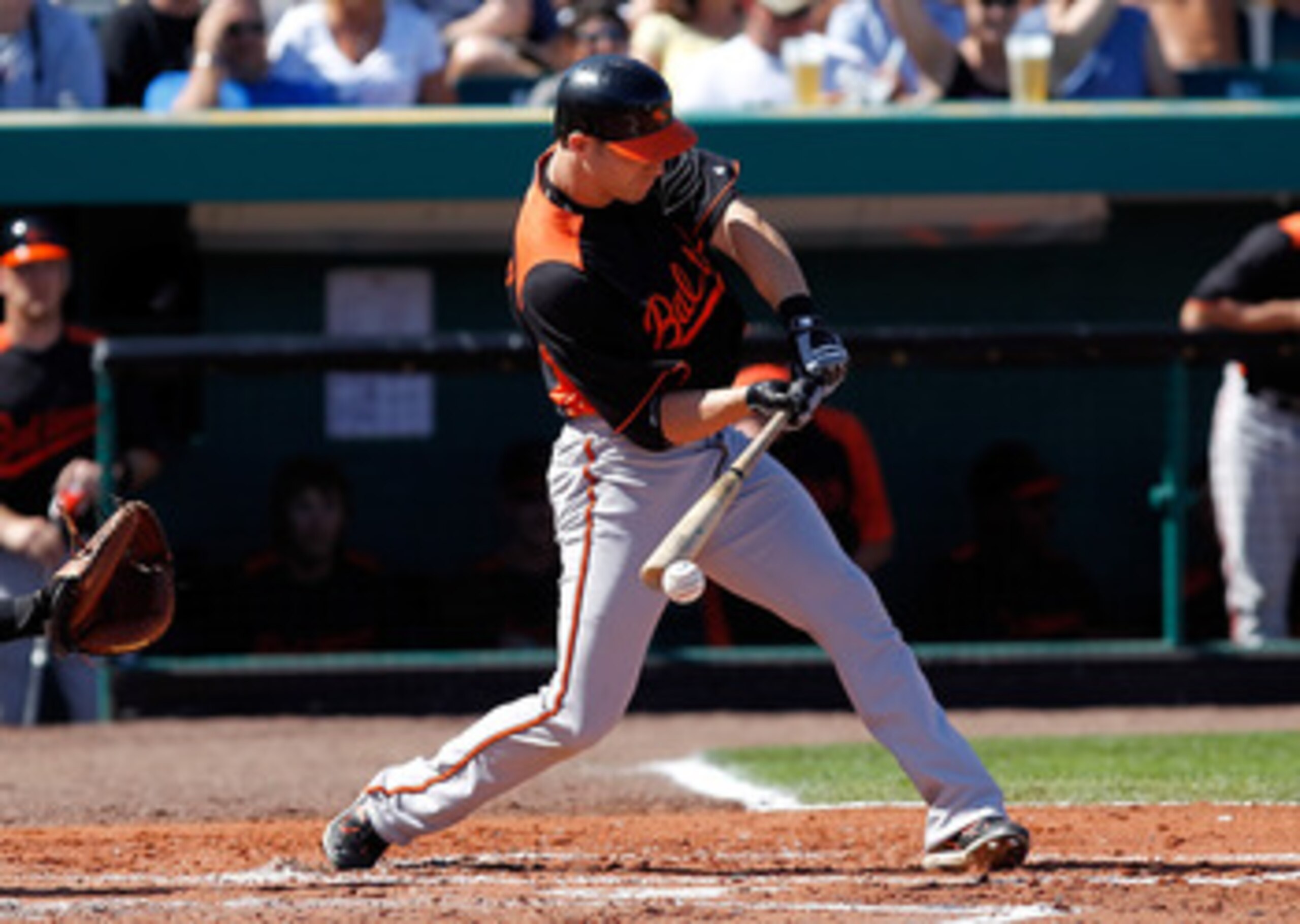 BRADENTON, FL - FEBRUARY 28:  Outfielder Nolan Reimold #14 of the Baltimore Orioles fouls off a pitch against the Pittsburgh Pirates during a Grapefruit League Spring Training Game at McKechnie Field on February 28, 2011 in Bradenton, Florida.  (Photo by