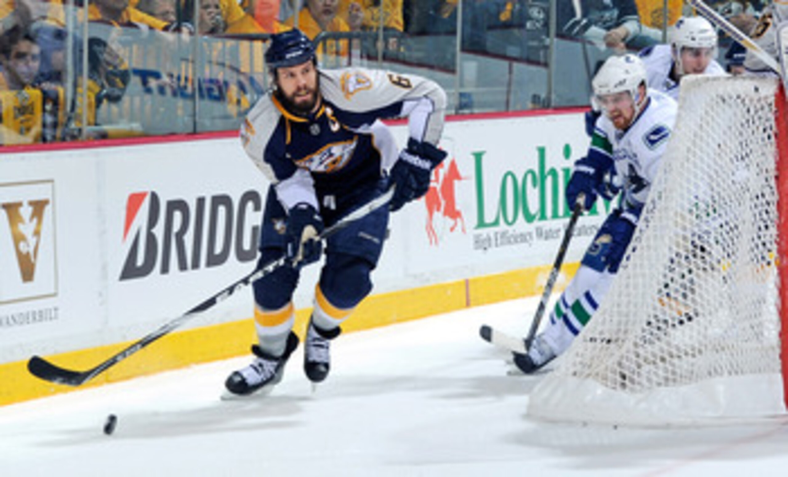 NASHVILLE, TN - MAY 03:  Shea Weber #6 of the Nashville Predators carries the puck behind the net and out of the reach of Henrk Sedin #33 of the Vancouver Canucks in Game Three of the Western Conference Semifinals during the 2011 NHL Stanley Cup Playoffs 