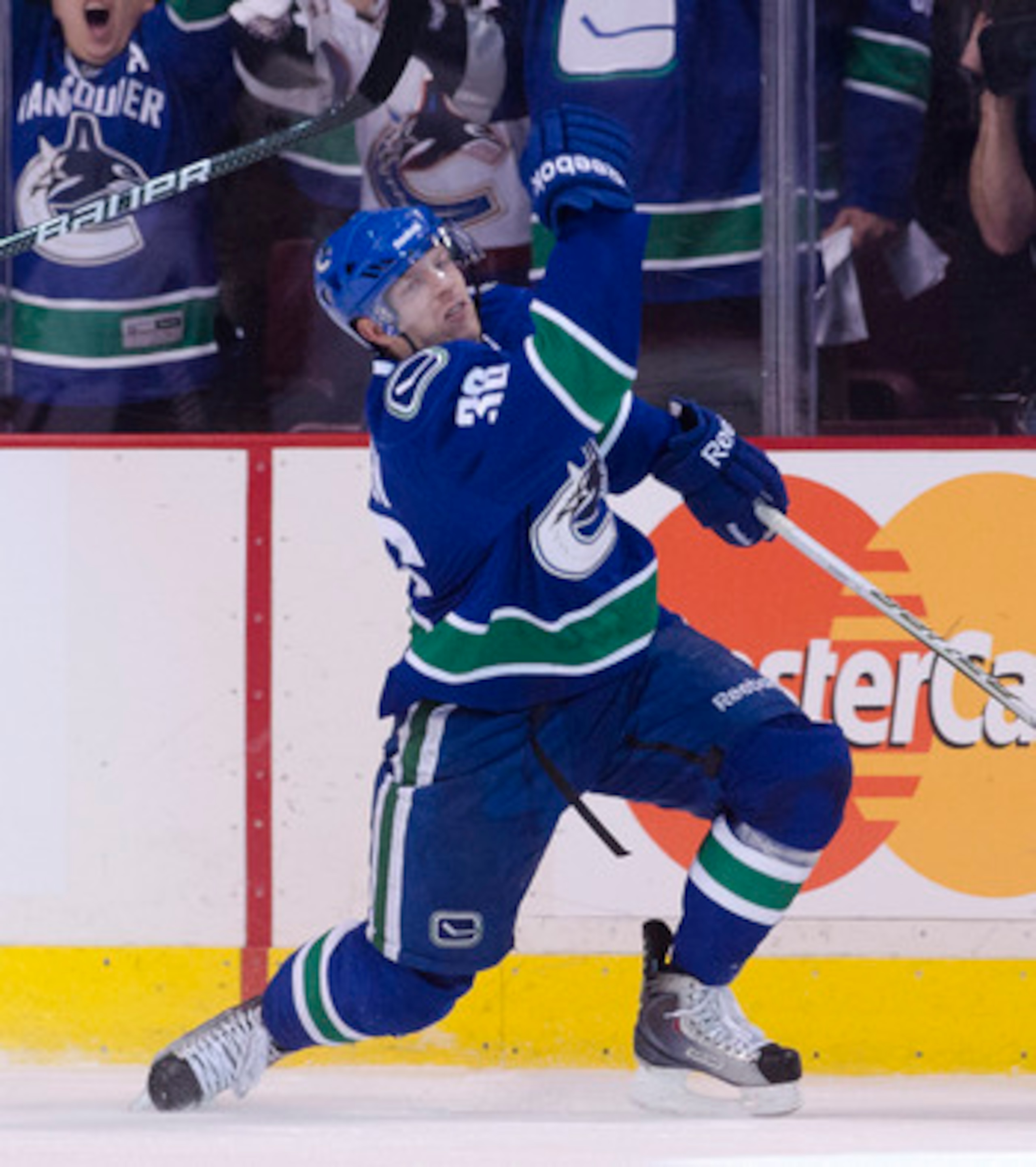 VANCOUVER, CANADA - APRIL 13: Jannik Hansen #36 of the Vancouver Canucks pumps his fist after scoring against the Chicago Blackhawks during the first period in Game One of the Western Conference Quarterfinals during the 2011 NHL Stanley Cup Playoffs on Ap