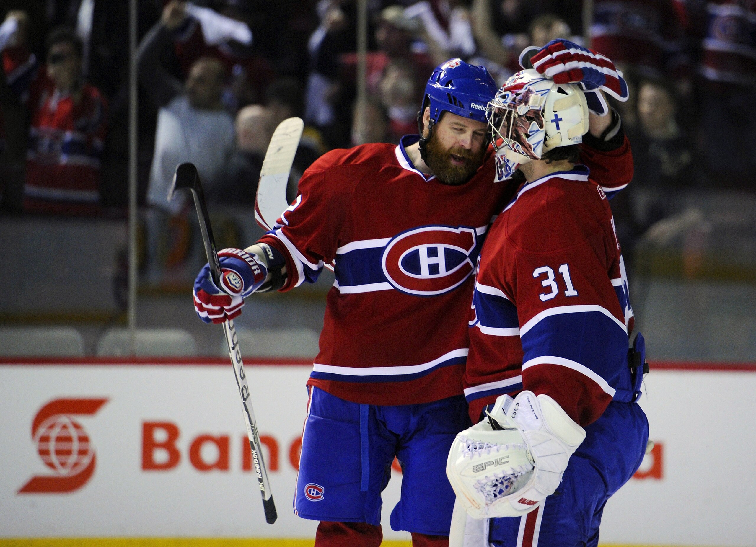 MONTREAL, CANADA - APRIL 26:  Paul Mara #22 of the Montreal Canadiens congratulates teammate Carey Price #31 on his victory over the Boston Bruins in Game Six of the Eastern Conference Quarterfinals during the 2011 NHL Stanley Cup Playoffs at the Bell Cen