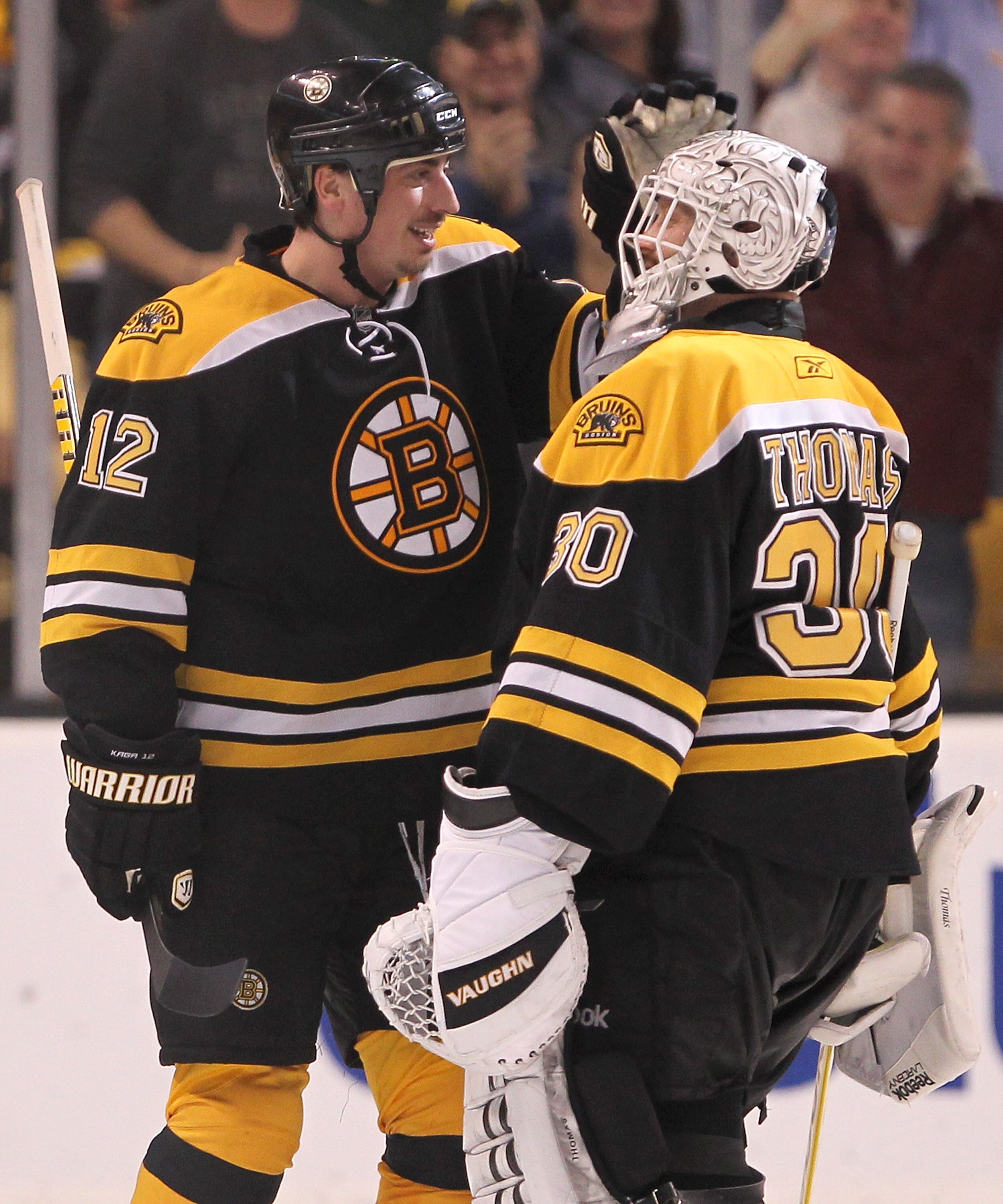 BOSTON, MA - APRIL 27:  Tomas Kaberle #12 of the Boston Bruins celebrates with goalie Tim Thomas #30 after defeating the Montreal Canadien in overtime of Game Seven of the Eastern Conference Quarterfinals during the 2011 NHL Stanley Cup Playoffs at TD Gar