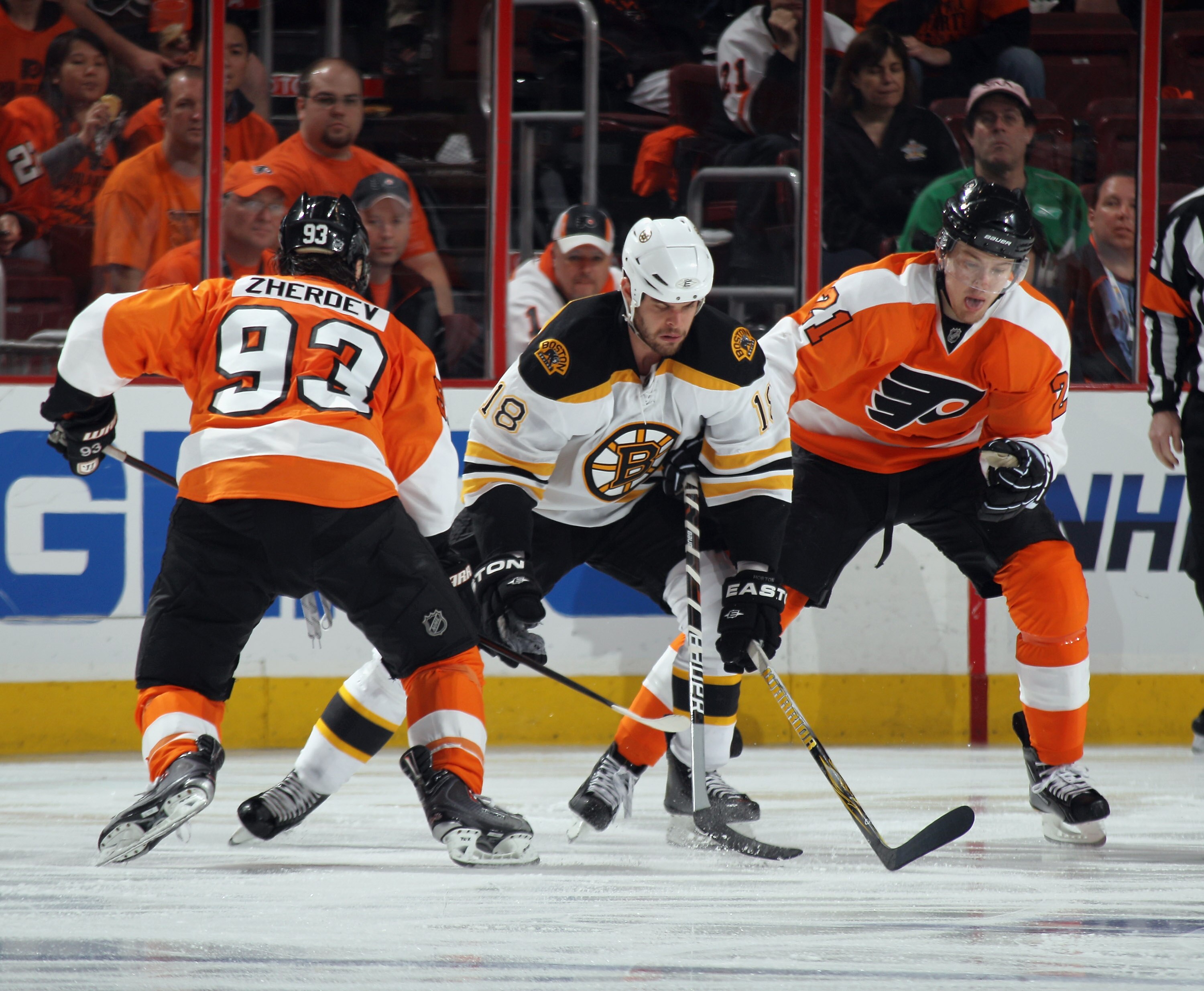 PHILADELPHIA, PA - APRIL 30: Nathan Horton #18 of the Boston Bruins carries the puck around Nikolay Zherdev #93 and James van Riemsdyk #21 of the Philadelphia Flyers in Game One of the Eastern Conference Semifinals during the 2011 NHL Stanley Cup Playoffs