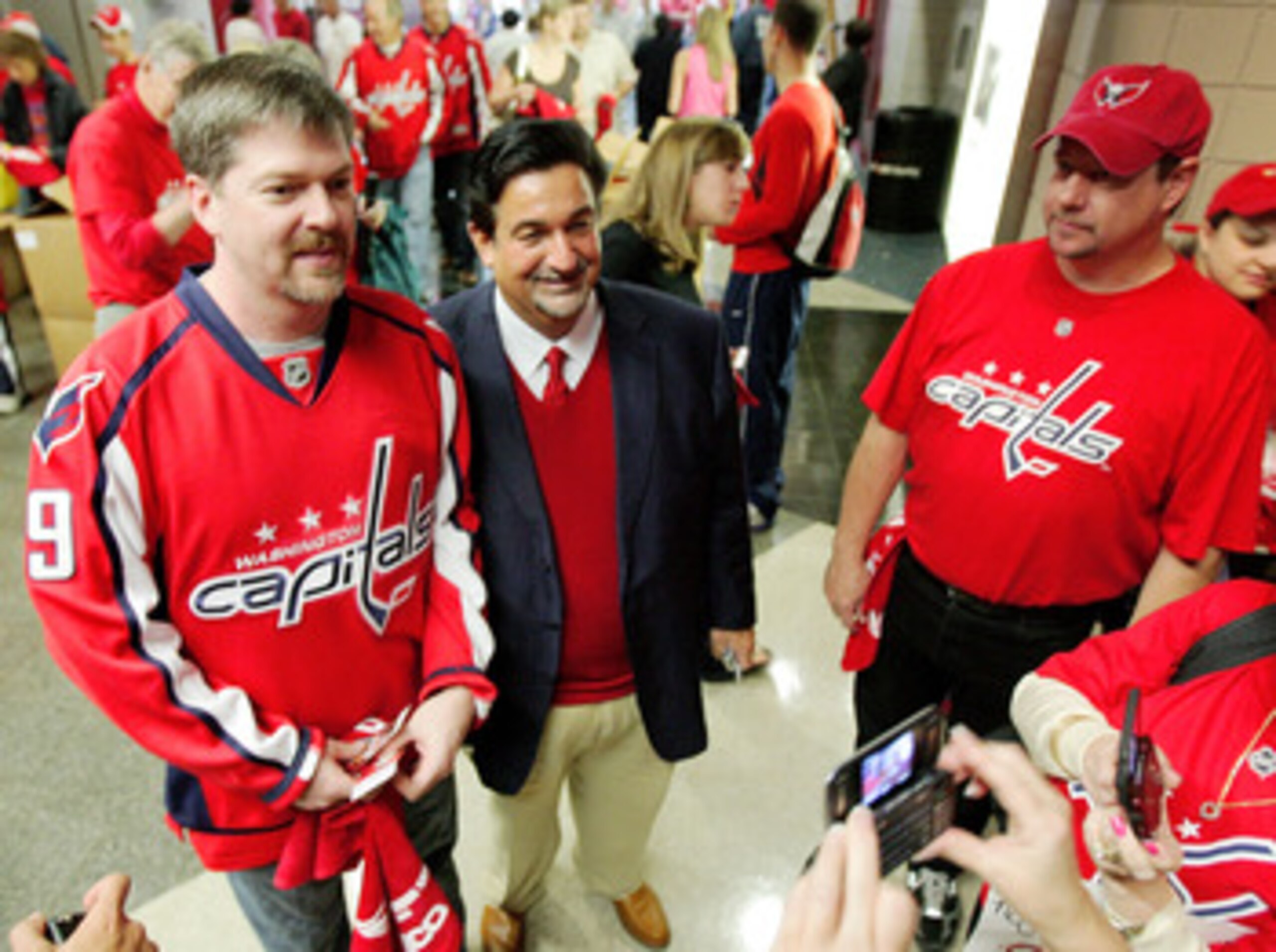 WASHINGTON - MAY 02:  Owner Ted Leonsis of the Washington Capitals poses with fans prior to the start of a NHL game against the Pittsburgh Penguins in Game One of the Eastern Conference Semifinal Round of the 2009 Stanley Cup Playoffs on May 2, 2009 at th