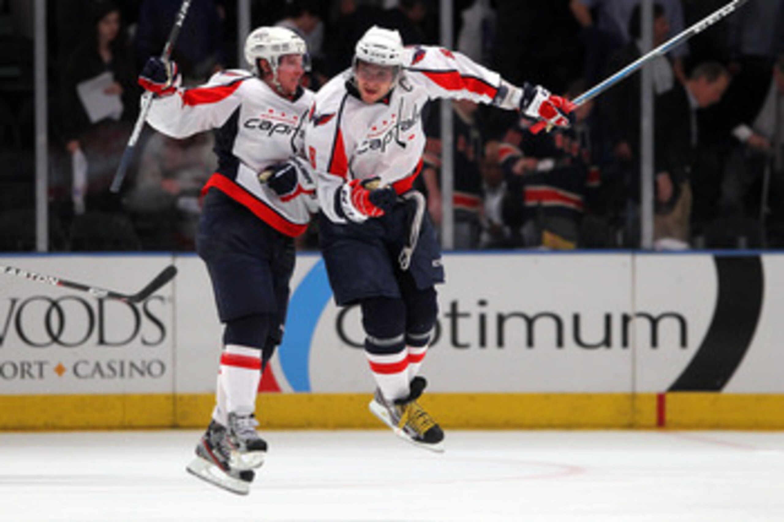 NEW YORK, NY - APRIL 20:  (L-R) Nicklas Backstrom #19 and Alex Ovechkin #8 of the Washington Capitals celebrate after they won 4-3 in the second overtime against the New York Rangers in Game Four of the Eastern Conference Quarterfinals during the 2011 NHL