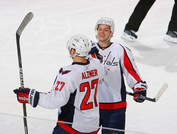 BUFFALO, NY - NOVEMBER 13: Karl Alzner #27 and John Carlson #74 of the Washington Capitals celebrate Alzner's goal in the first period against the Buffalo Sabres  at HSBC Arena on November 13, 2010 in Buffalo, New York.  (Photo by Rick Stewart/Getty Image