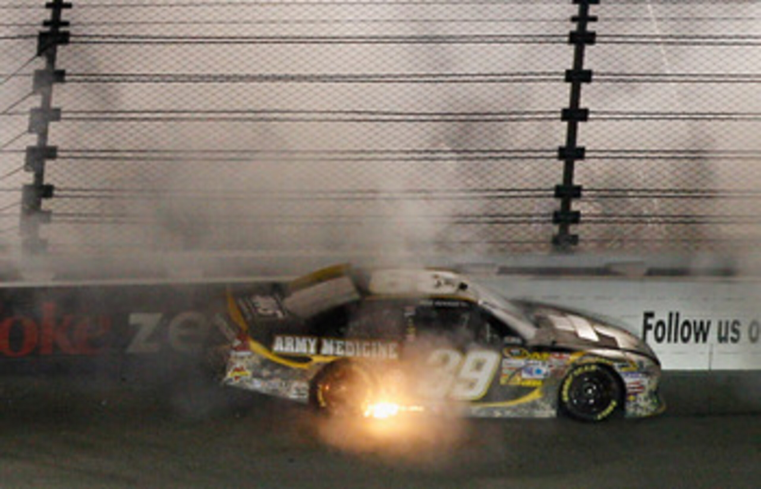 RICHMOND, VA - APRIL 30:  Ryan Newman, driver of the #39 U.S. Army Medicine Chevrolet, spins off of turn three during the NASCAR Sprint Cup Series Crown Royal Presents The Matthew & Daniel Hansen 400 at Richmond International Raceway on April 30, 2011 in