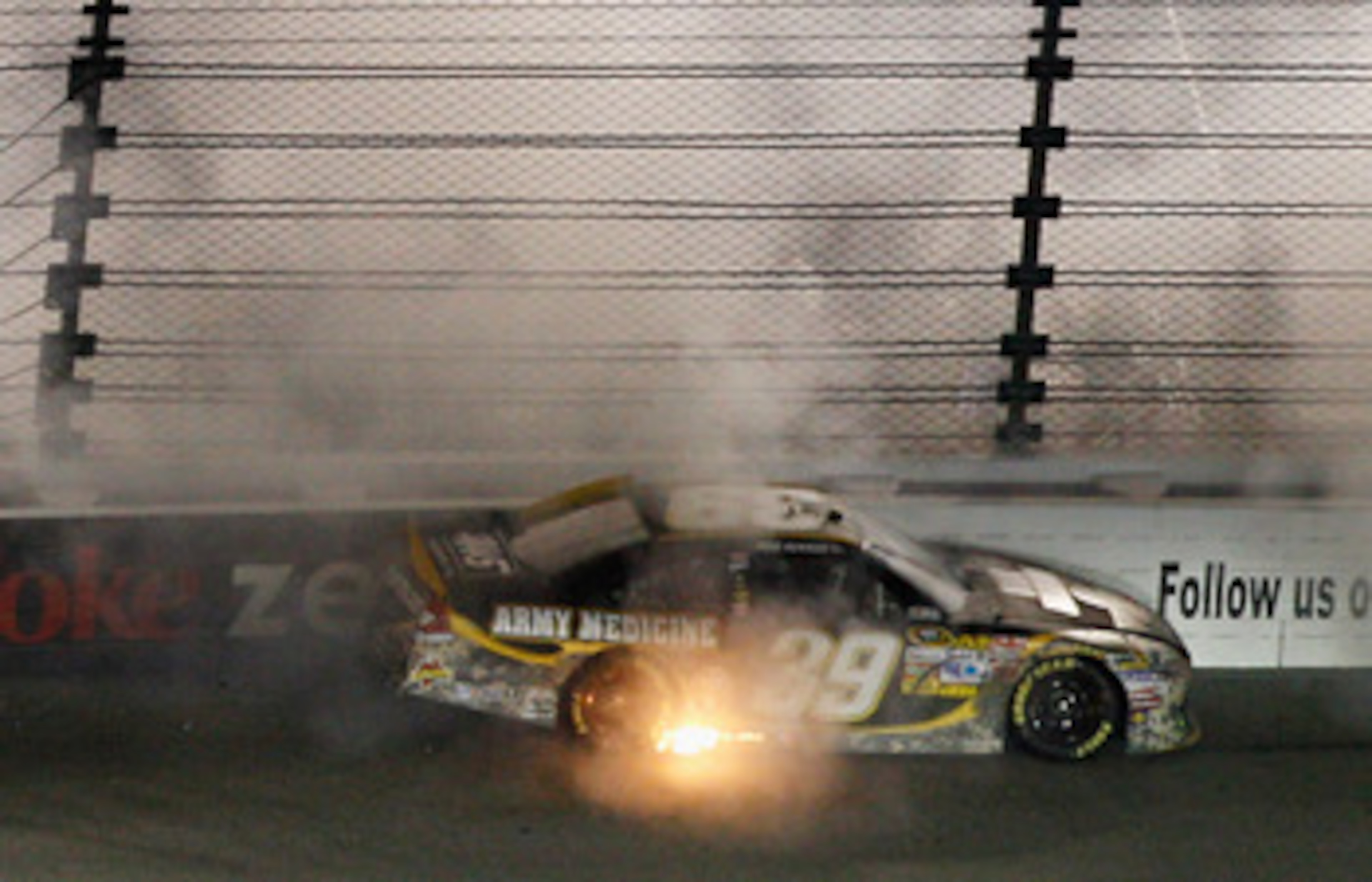 RICHMOND, VA - APRIL 30:  Ryan Newman, driver of the #39 U.S. Army Medicine Chevrolet, spins off of turn three during the NASCAR Sprint Cup Series Crown Royal Presents The Matthew & Daniel Hansen 400 at Richmond International Raceway on April 30, 2011 in