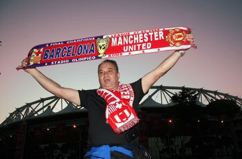 ROME - MAY 26:  A Manchester United fan poses in front the Stadio Olimpico ahead of the UEFA Champions League Final between Barcelona and and Manchester United at the Stadio Olimpico on May 26, 2009 in Rome, Italy.  (Photo by Franco Origlia/Getty Images)