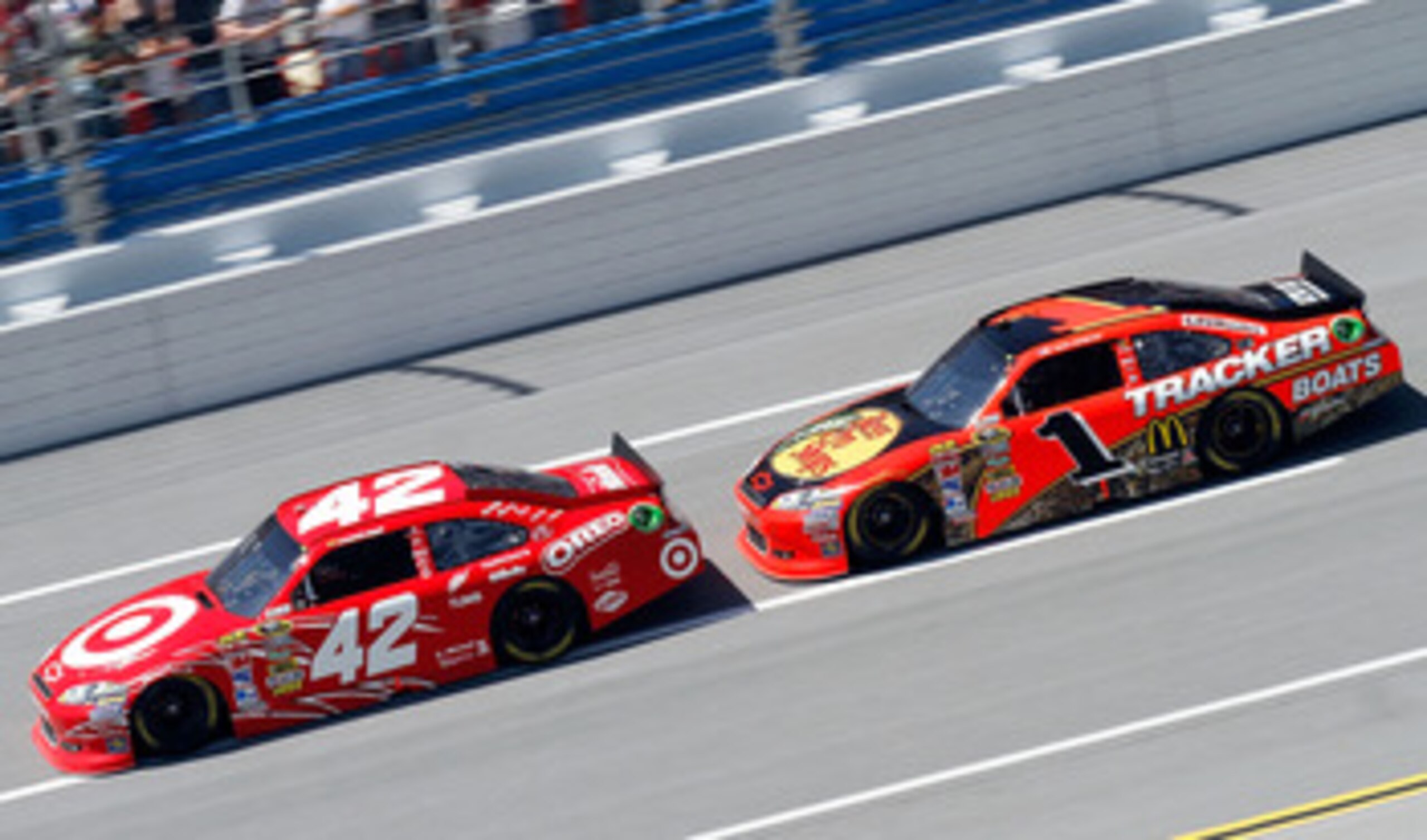 TALLADEGA, AL - APRIL 17:  Juan Pablo Montoya, driver of the #42 Target Chevrolet, leads Jamie McMurray, driver of the #1 Bass Pro Shops/Tracker Boats Chevrolet, during the NASCAR Sprint Cup Series Aaron's 499 at Talladega Superspeedway on April 17, 2011