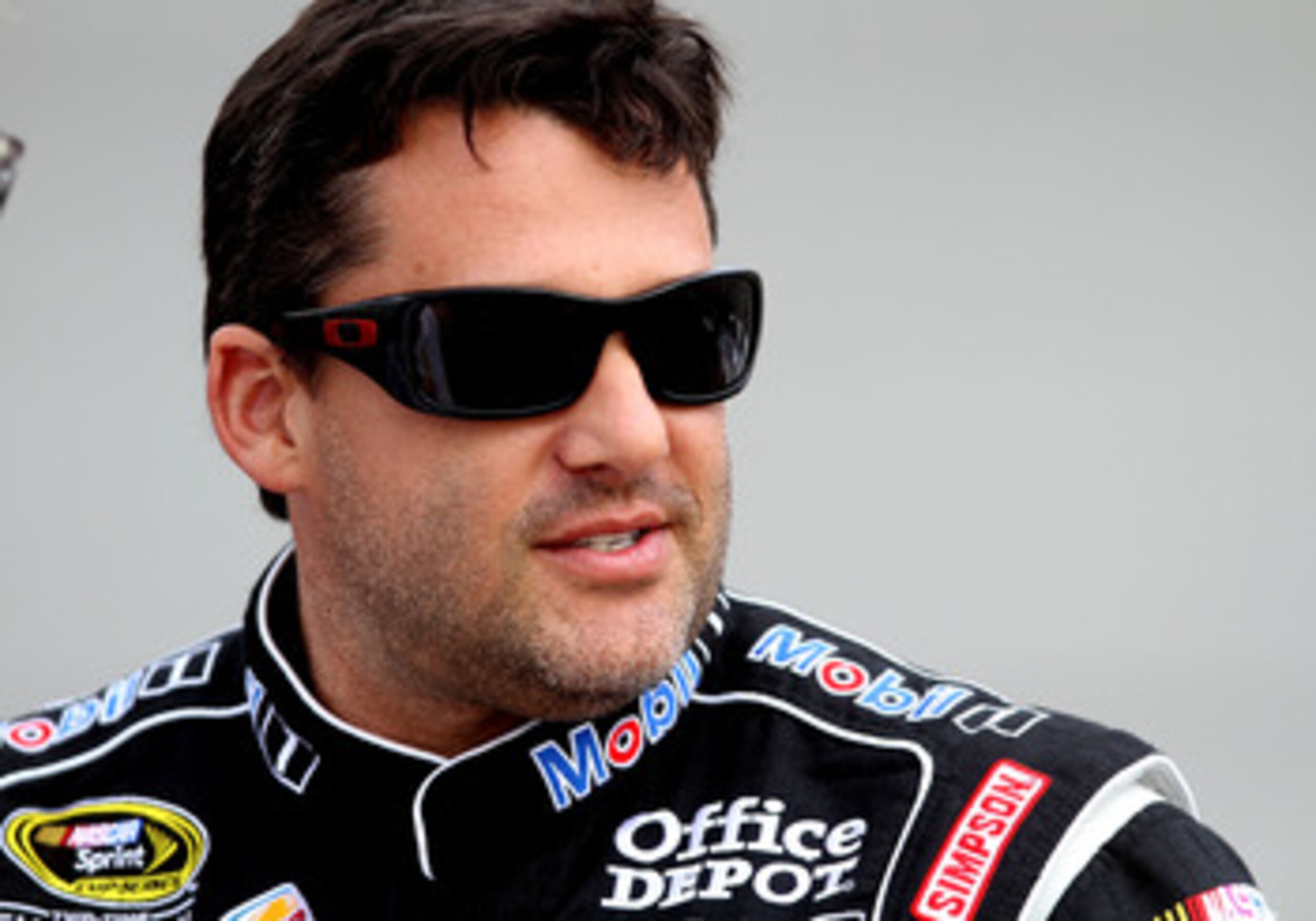 RICHMOND, VA - APRIL 29:  Tony Stewart, driver of the #14 Mobil 1/Office Depot Chevrolet, stands on pit road during qualifying for the NASCAR Sprint Cup Series Crown Royal Presents The Matthew & Daniel Hansen 400 at Richmond International Raceway on April