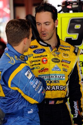 JOLIET, IL - JULY 09:  Paul Menard, driver of the #98 Moen / Menards Ford talks with AJ Allmendinger, driver of the #43 Geek Squad Ford during practice for the NASCAR Sprint Cup Series LIFELOCK.COM 400 at the Chicagoland Speedway on July 9, 2010 in Joliet