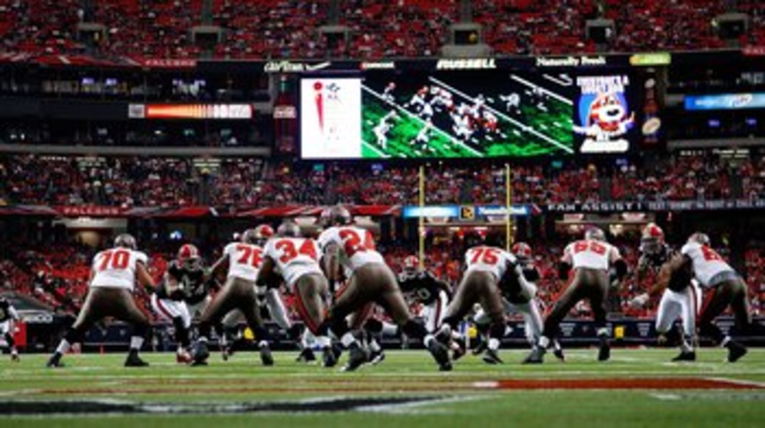 ATLANTA - NOVEMBER 29:  The Tampa Bay Buccaneers offense runs a play against the Atlanta Falcons defense at Georgia Dome on November 29, 2009 in Atlanta, Georgia.  (Photo by Kevin C. Cox/Getty Images)