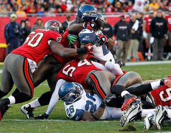 TAMPA, FL - DECEMBER 26: Running back Marshawn Lynch #24 of the Seattle Seahawks is stopped at the goal line by the Tampa Bay Buccaneers defense during the game at Raymond James Stadium on December 26, 2010 in Tampa, Florida. (Photo by J. Meric/Getty Imag