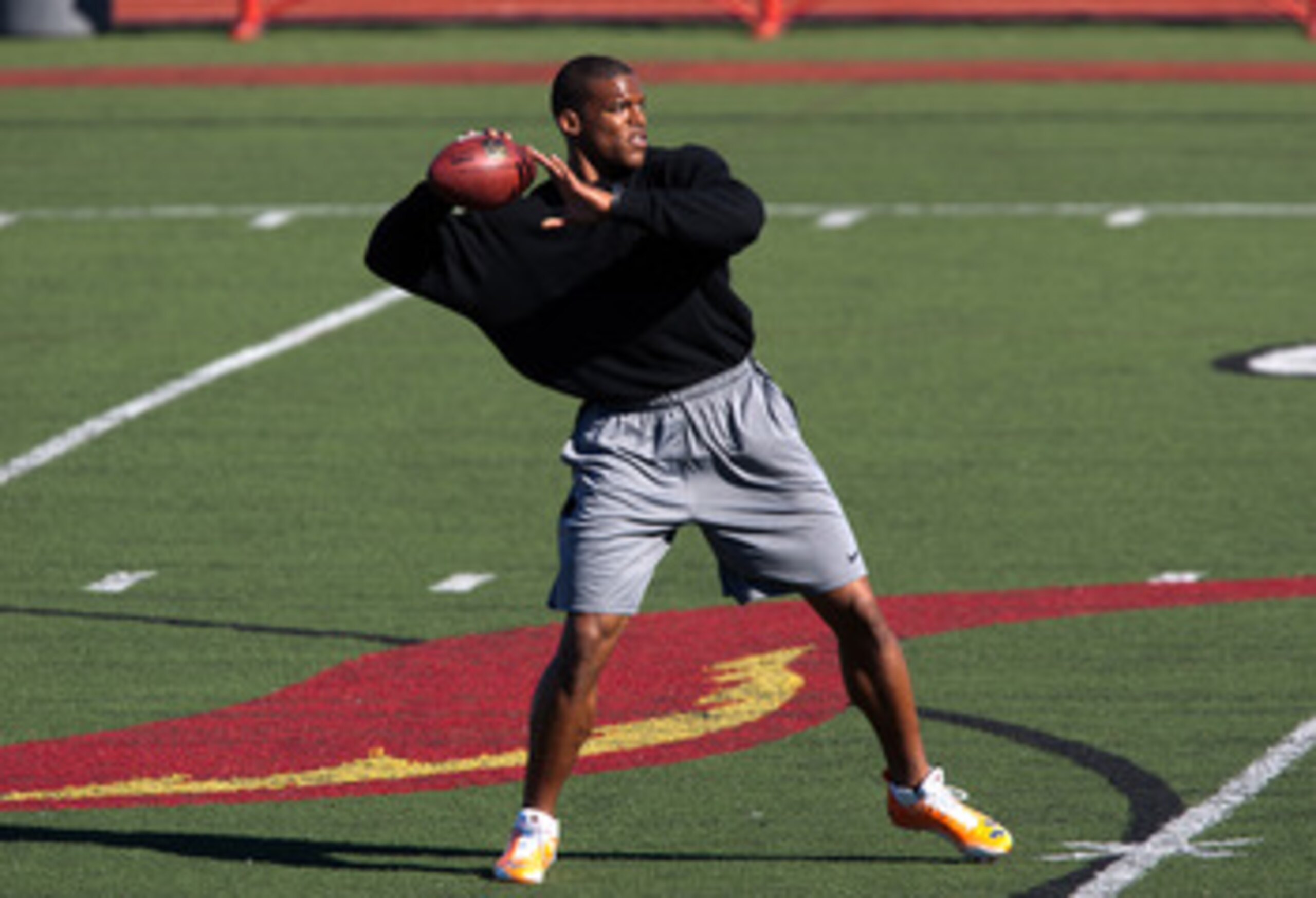 SAN DIEGO, CA - FEBRUARY 10: 2010 Heisman Trophy winning quarterback Cam Newton of Auburn throws the ball during his workout routine for the media at Cathedral High School's sports stadium on February 10, 2011 in San Diego, California. (Photo by Kent Horn SAN DIEGO, CA - FEBRUARY 10: 2010 Heisman Trophy winning quarterback Cam Newton of Auburn throws the ball during his workout routine for the media at Cathedral High School's sports stadium on February 10, 2011 in San Diego, California. (Photo by Kent Horn