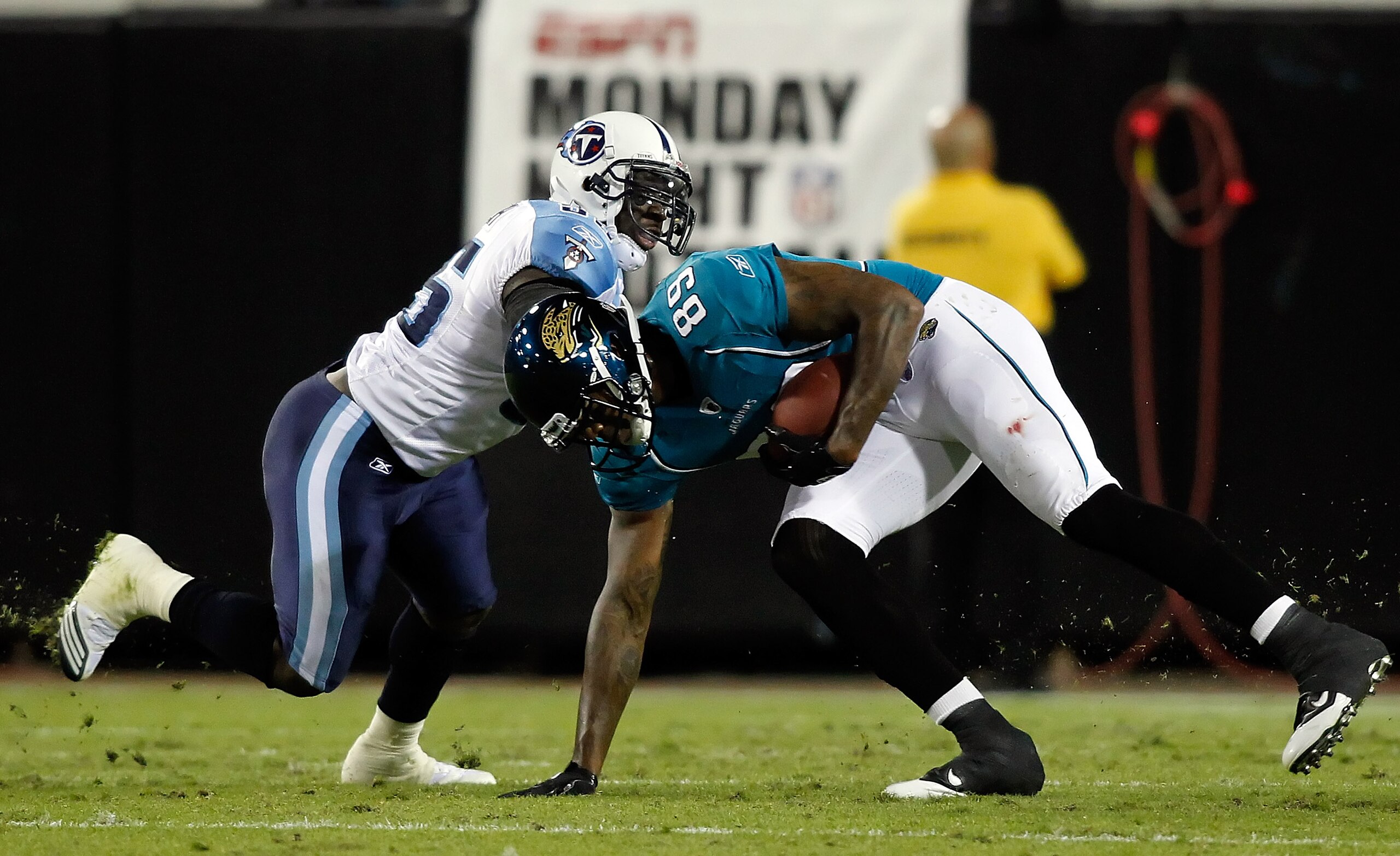 JACKSONVILLE, FL - OCTOBER 18:  Receiver Marcedes Lewis #89 of the Jacksonville Jaguars is tackled by linebacker Stephen Tulloch #55 of the Tennessee Titans during the game at EverBank Field on October 18, 2010 in Jacksonville, Florida.  (Photo by J. Meri