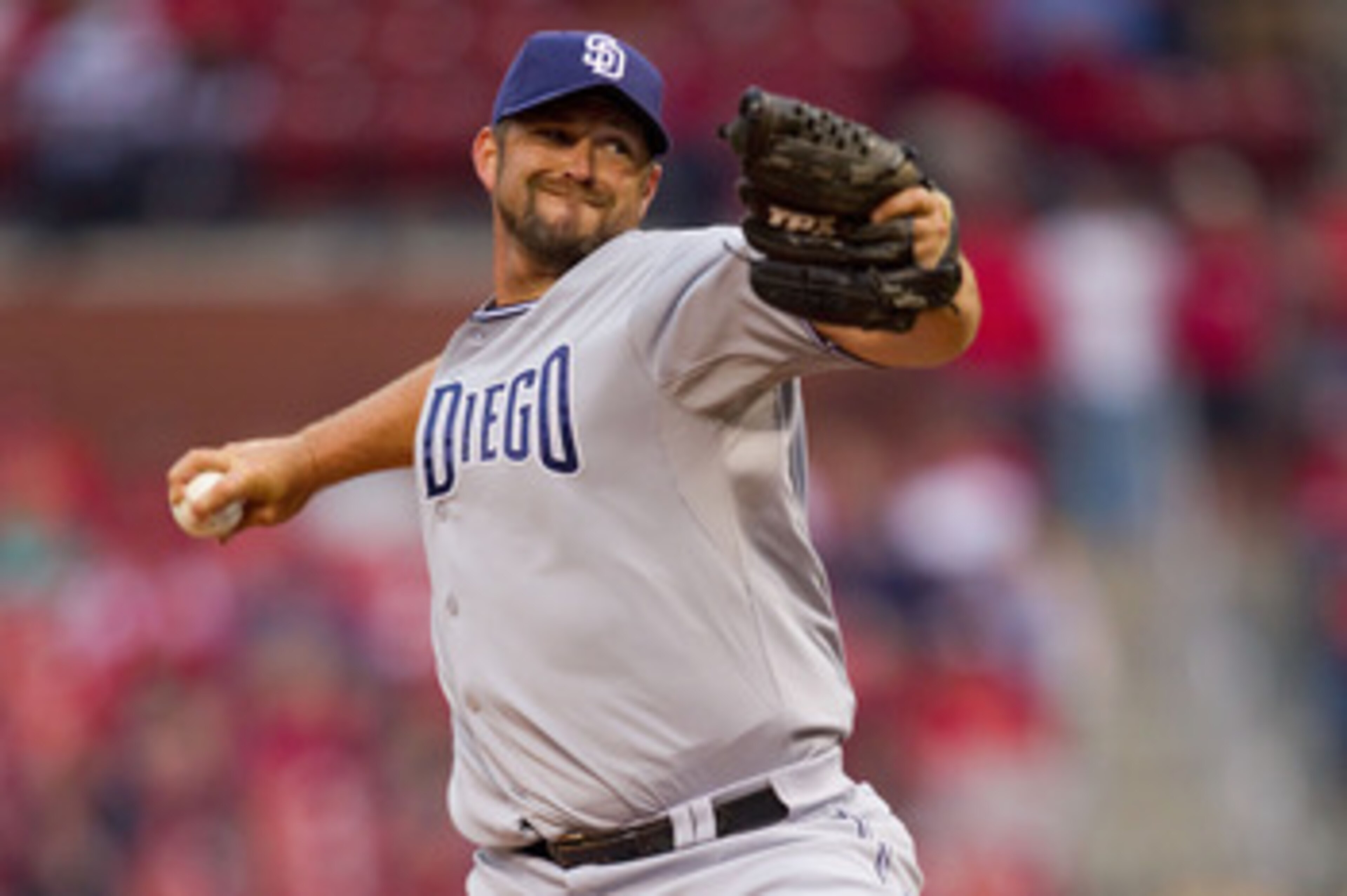 ST. LOUIS, MO - MARCH 31: Reliever Heath Bell #21 of the San Diego Padres pitches against the St. Louis Cardinals on opening day at Busch Stadium on March 31, 2011 in St. Louis, Missouri.  (Photo by Dilip Vishwanat/Getty Images)
