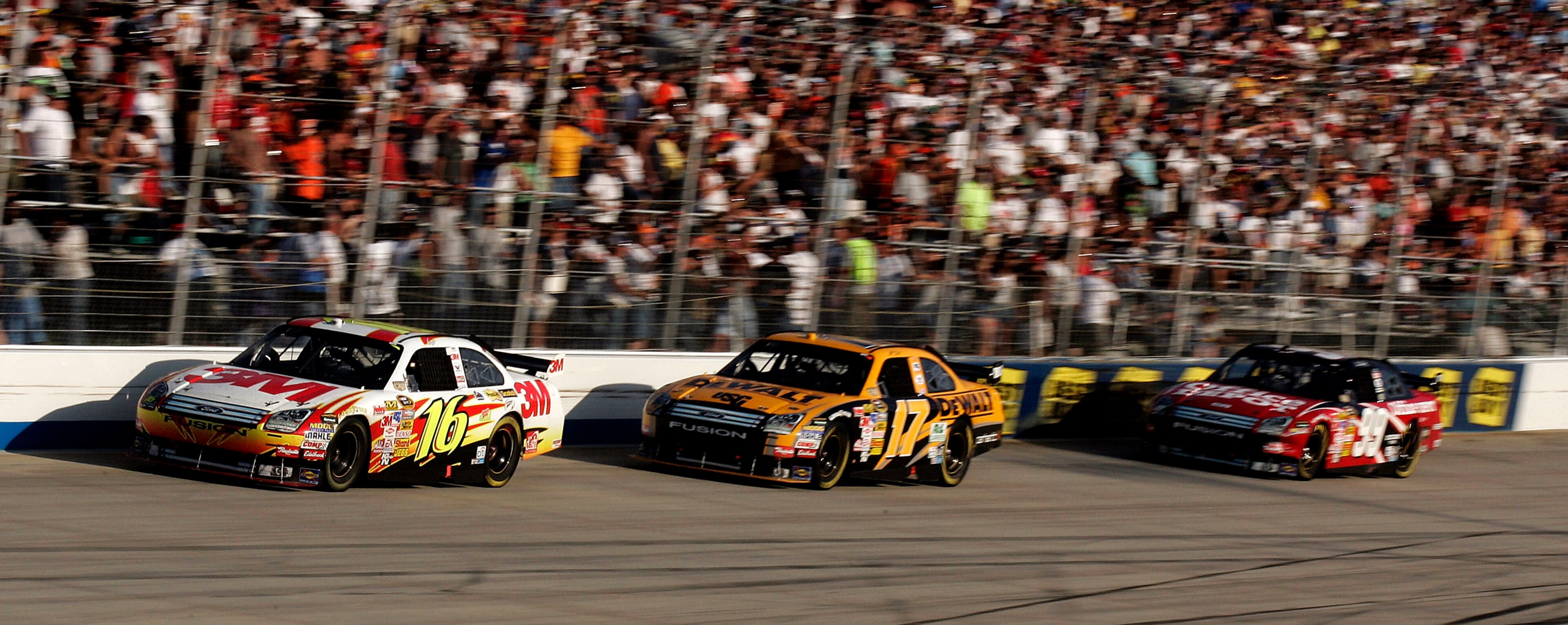 DOVER, DE - SEPTEMBER 21:  Greg Biffle, driver of the #16 3M Ford, leads teammates Matt Kenseth, driver of the #17 DeWalt Ford, and Carl Edwards, driver of the #99 Office Depot Ford, during the NASCAR Sprint Cup Series Camping World RV 400 at Dover Intern